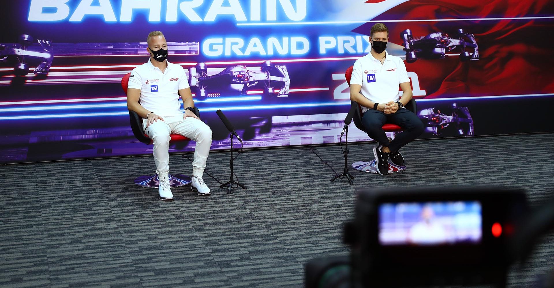 BAHRAIN INTERNATIONAL CIRCUIT, BAHRAIN - MARCH 25: Nikita Mazepin, Haas F1, and Mick Schumacher, Haas F1, in the press conference during the Bahrain GP at Bahrain International Circuit on Thursday March 25, 2021 in Sakhir, Bahrain. (Copyright Free for Editorial Use Only. Credit: FIA Pool / LAT Images)