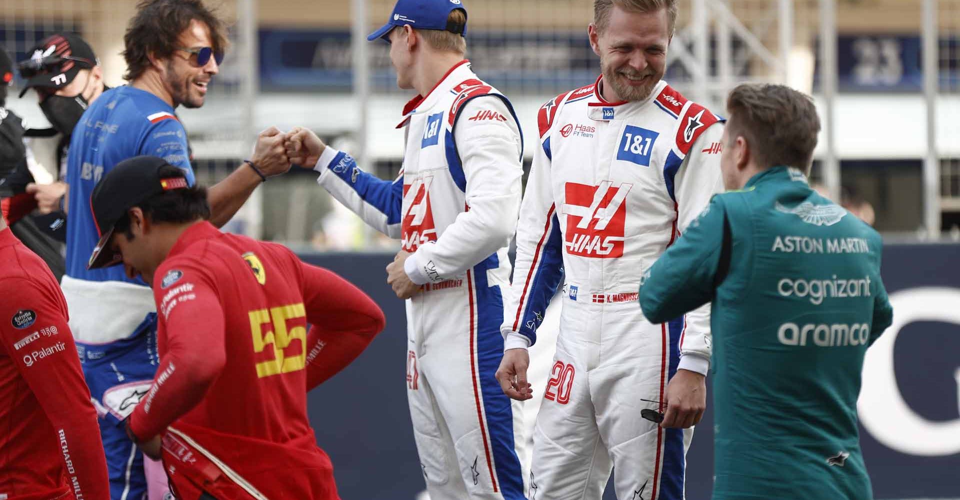 BAHRAIN INTERNATIONAL CIRCUIT, BAHRAIN - MARCH 20: Fernando Alonso, Alpine F1 Team, Mick Schumacher, Haas F1 Team, Kevin Magnussen, Haas F1 Team, and Nico Hulkenberg, Aston Martin, at the drivers parade during the Bahrain GP at Bahrain International Circuit on Sunday March 20, 2022 in Sakhir, Bahrain. (Photo by Andy Hone / LAT Images)