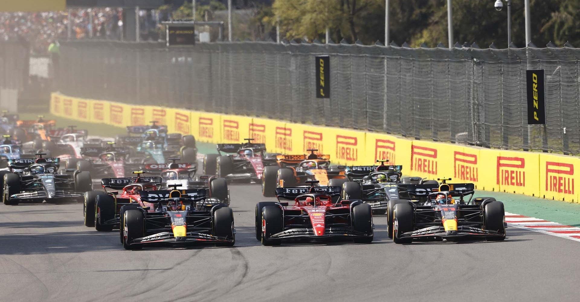 AUTODROMO HERMANOS RODRIGUEZ, MEXICO - OCTOBER 29: Charles Leclerc, Ferrari SF-23, leads Sergio Perez, Red Bull Racing RB19, Max Verstappen, Red Bull Racing RB19, Daniel Ricciardo, AlphaTauri AT04, Sir Lewis Hamilton, Mercedes F1 W14, and the rest of the field at the start during the Mexico City GP at Autodromo Hermanos Rodriguez on Sunday October 29, 2023 in Mexico City, Mexico. (Photo by Andy Hone / LAT Images)