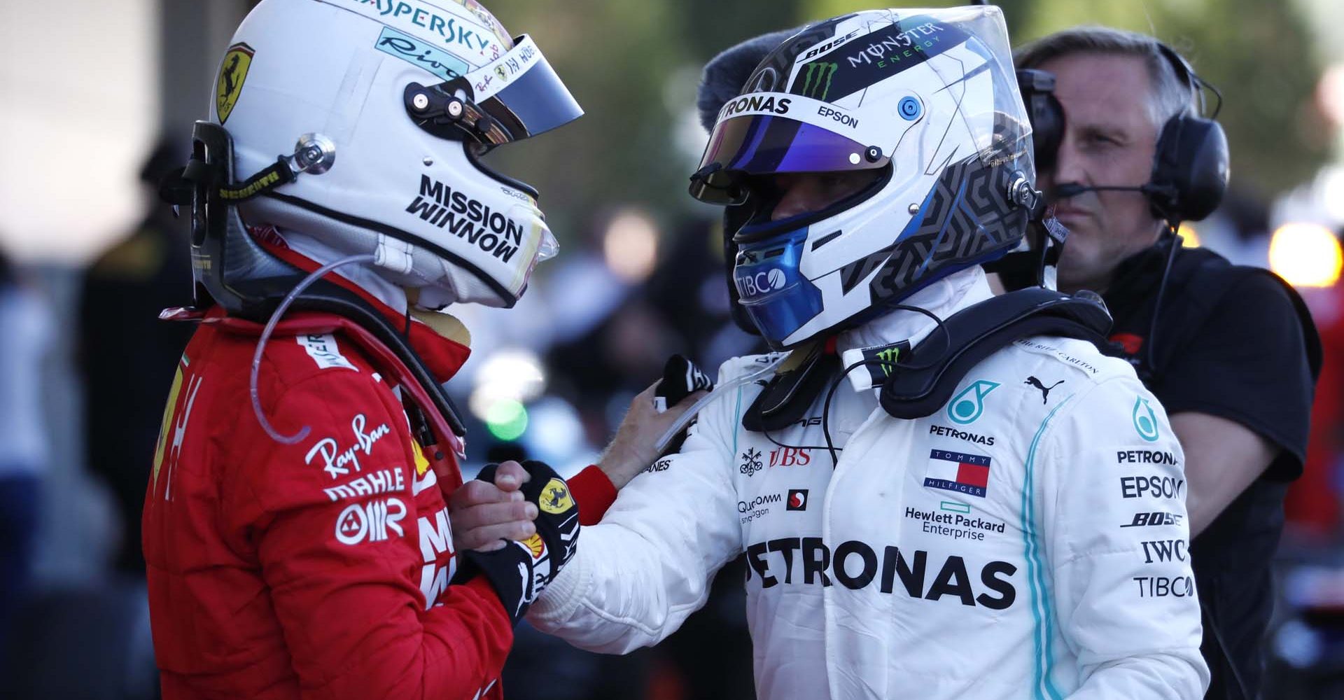 Formula One F1 - Japanese Grand Prix - Suzuka Circuit, Suzuka, Japan - October 13, 2019. Mercedes' Valtteri Bottas shakes hands with Ferrari's Sebastian Vettel after winning the race. REUTERS/Issei Kato