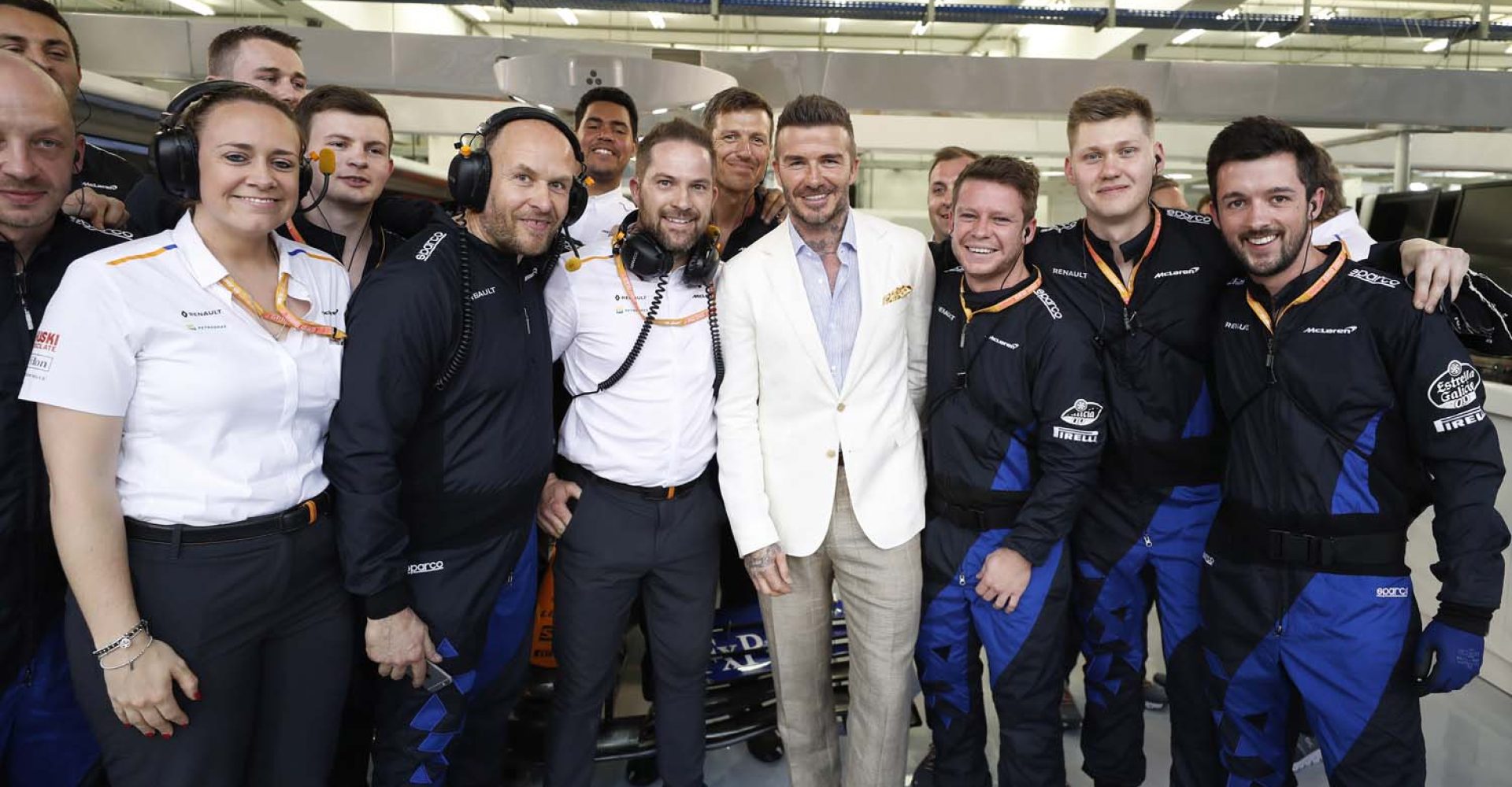 Footballer David Beckham meets the team in the garage