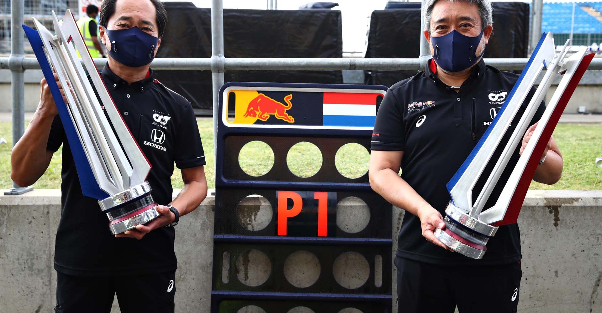 NORTHAMPTON, ENGLAND - AUGUST 09: Toyoharu Tanabe of Honda and Masashi Yamamoto of Honda celebrate the win of Max Verstappen of Netherlands and Red Bull Racing after the F1 70th Anniversary Grand Prix at Silverstone on August 09, 2020 in Northampton, England. (Photo by Mark Thompson/Getty Images) // Getty Images / Red Bull Content Pool  // AP-24VZHS93H1W11 // Usage for editorial use only //