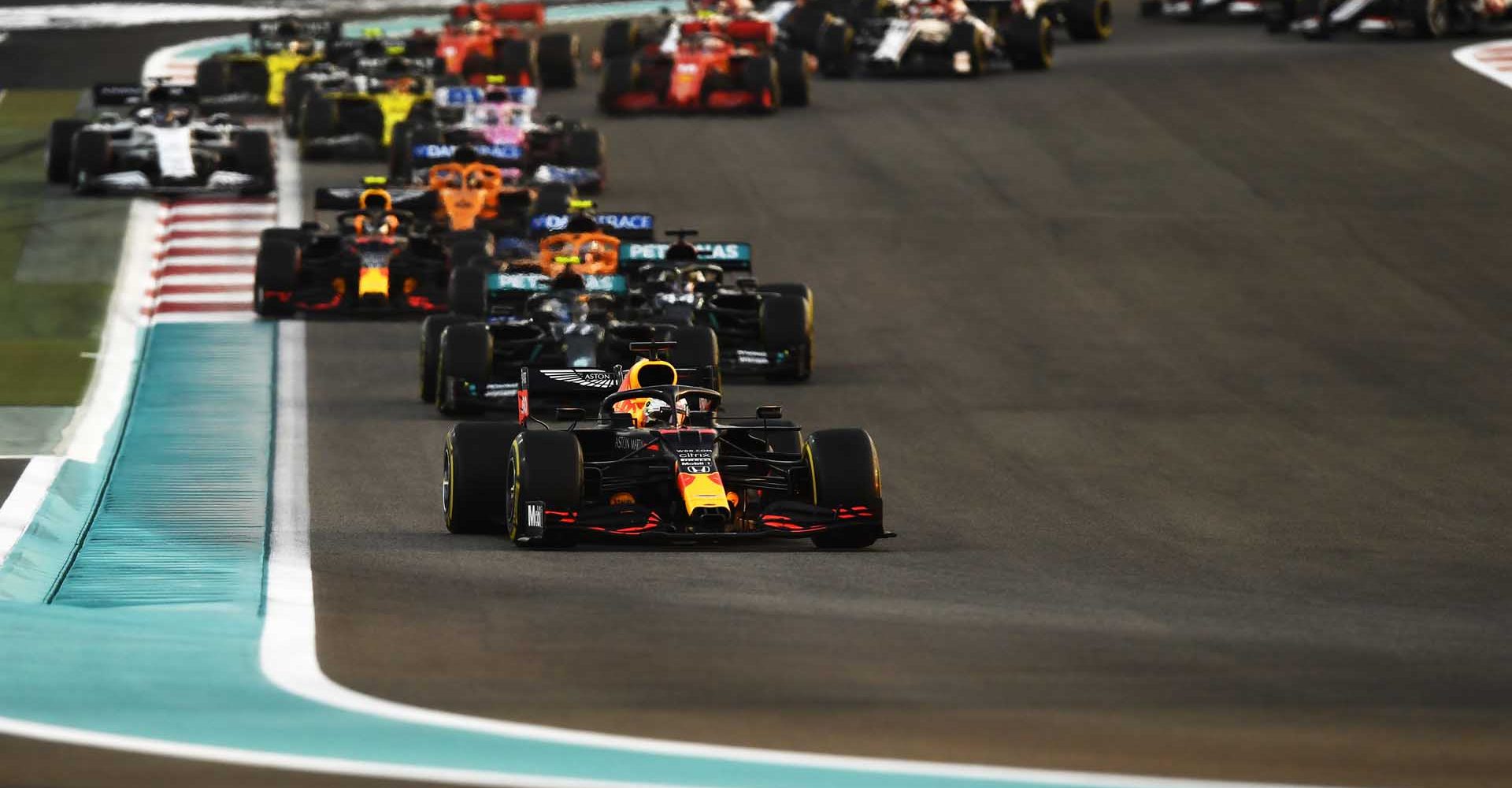 ABU DHABI, UNITED ARAB EMIRATES - DECEMBER 13: Max Verstappen of the Netherlands driving the (33) Aston Martin Red Bull Racing RB16 leads the field at the start during the F1 Grand Prix of Abu Dhabi at Yas Marina Circuit on December 13, 2020 in Abu Dhabi, United Arab Emirates. (Photo by Rudy Carezzevoli/Getty Images)