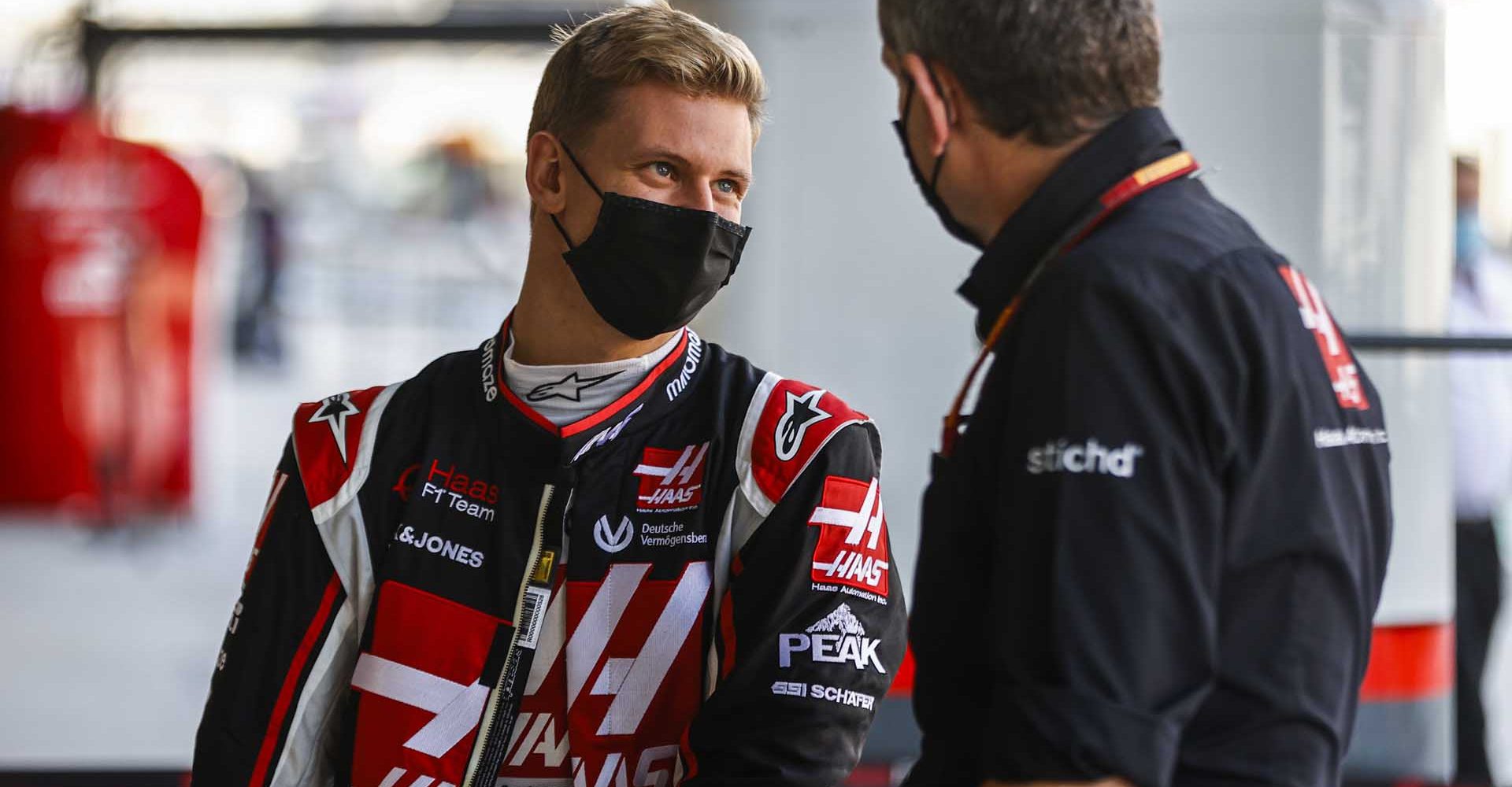 YAS MARINA CIRCUIT, UNITED ARAB EMIRATES - DECEMBER 10: Mick Schumacher, Haas F1, with Guenther Steiner, Team Principal, Haas F1 during the Abu Dhabi GP at Yas Marina Circuit on Thursday December 10, 2020 in Abu Dhabi, United Arab Emirates. (Photo by Andy Hone / LAT Images)