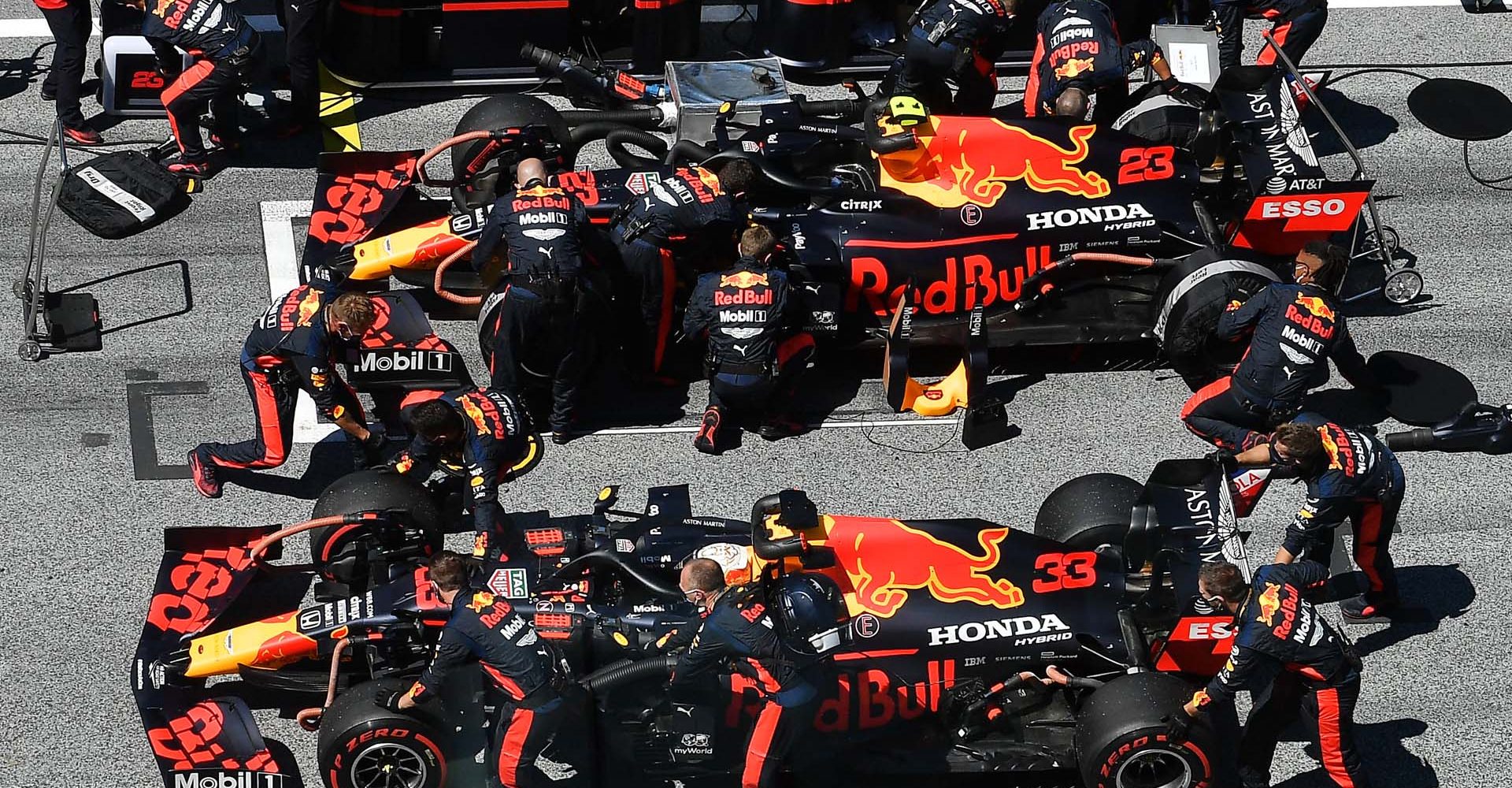 SPIELBERG, AUSTRIA - JULY 05: The cars of Max Verstappen of Netherlands and Red Bull Racing and Alexander Albon of Thailand and Red Bull Racing are prepared on the grid ahead of the Formula One Grand Prix of Austria at Red Bull Ring on July 05, 2020 in Spielberg, Austria. (Photo by Joe Klamar/Pool via Getty Images)