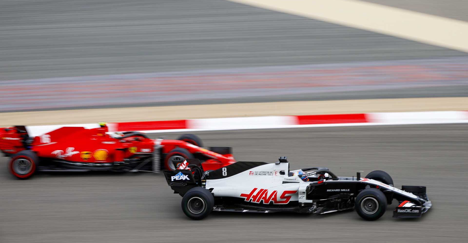 BAHRAIN INTERNATIONAL CIRCUIT, BAHRAIN - NOVEMBER 27: Romain Grosjean, Haas VF-20, leads Charles Leclerc, Ferrari SF1000 during the Bahrain GP at Bahrain International Circuit on Friday November 27, 2020 in Sakhir, Bahrain. (Photo by Andy Hone / LAT Images)