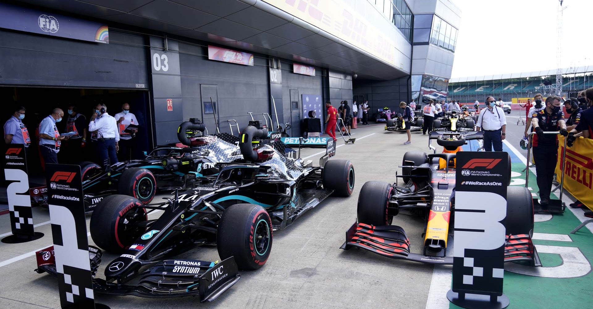 NORTHAMPTON, ENGLAND - AUGUST 01: The cars of Lewis Hamilton of Great Britain and Mercedes GP, Max Verstappen of Netherlands and Red Bull Racing and Valtteri Bottas of Finland and Mercedes GP in parc ferme after qualifying for the F1 Grand Prix of Great Britain at Silverstone on August 01, 2020 in Northampton, England. (Photo by Will Oliver/Pool via Getty Images)