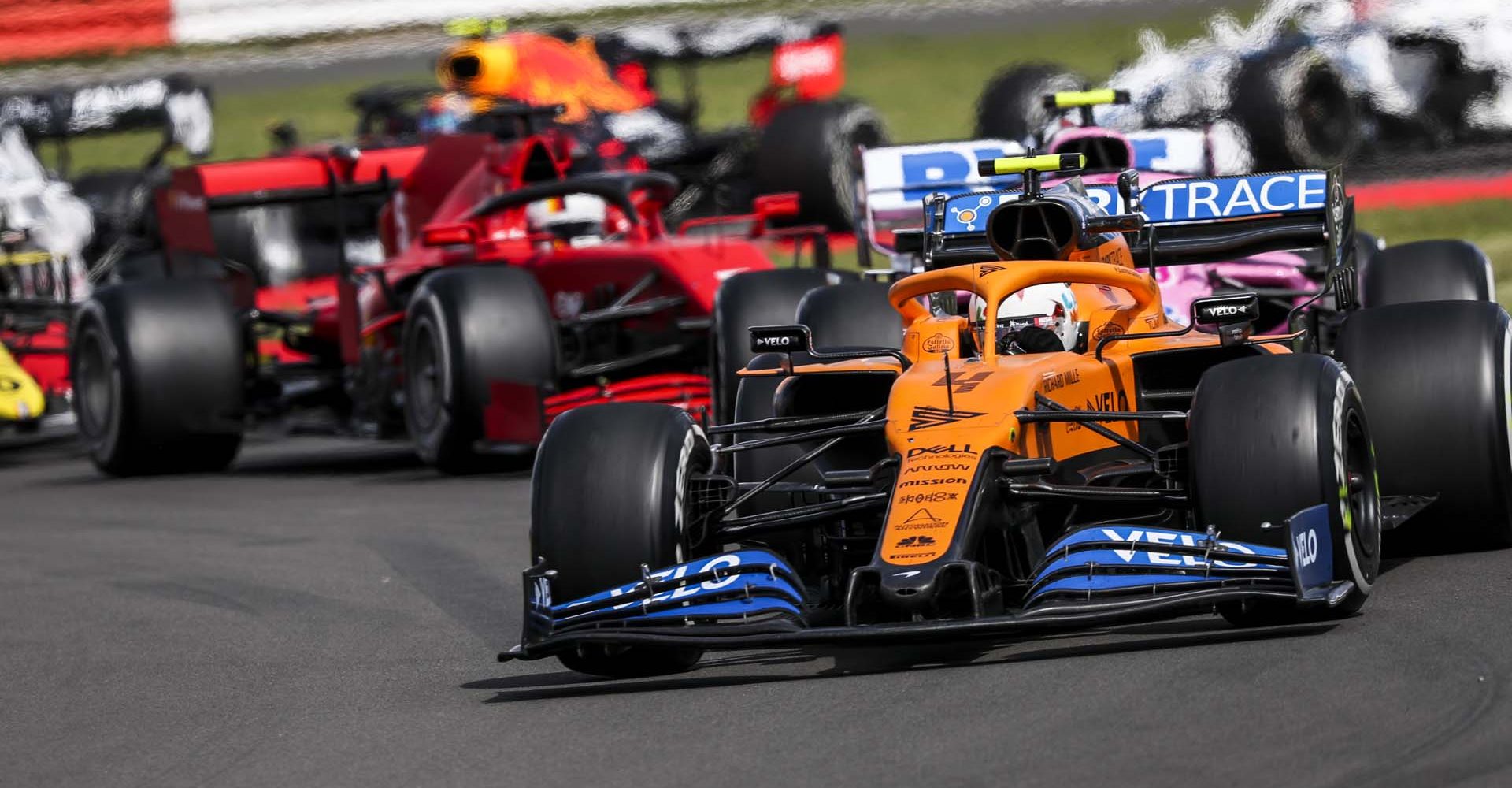 Lando Norris, McLaren MCL35, leads Lance Stroll, Racing Point RP20, Sebastian Vettel, Ferrari SF1000, and Esteban Ocon, Renault R.S.20