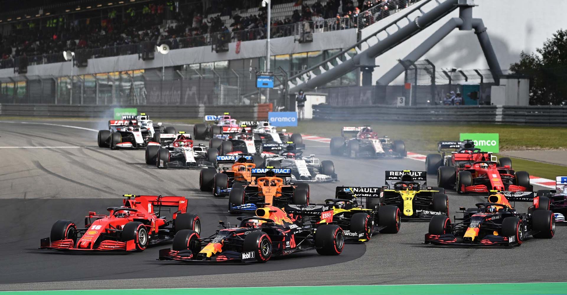 NUERBURG, GERMANY - OCTOBER 11: Max Verstappen of the Netherlands driving the (33) Aston Martin Red Bull Racing RB16 battles for position with Charles Leclerc of Monaco driving the (16) Scuderia Ferrari SF1000 at the start of the race during the F1 Eifel Grand Prix at Nuerburgring on October 11, 2020 in Nuerburg, Germany. (Photo by Ina Fassbender - Pool/Getty Images)