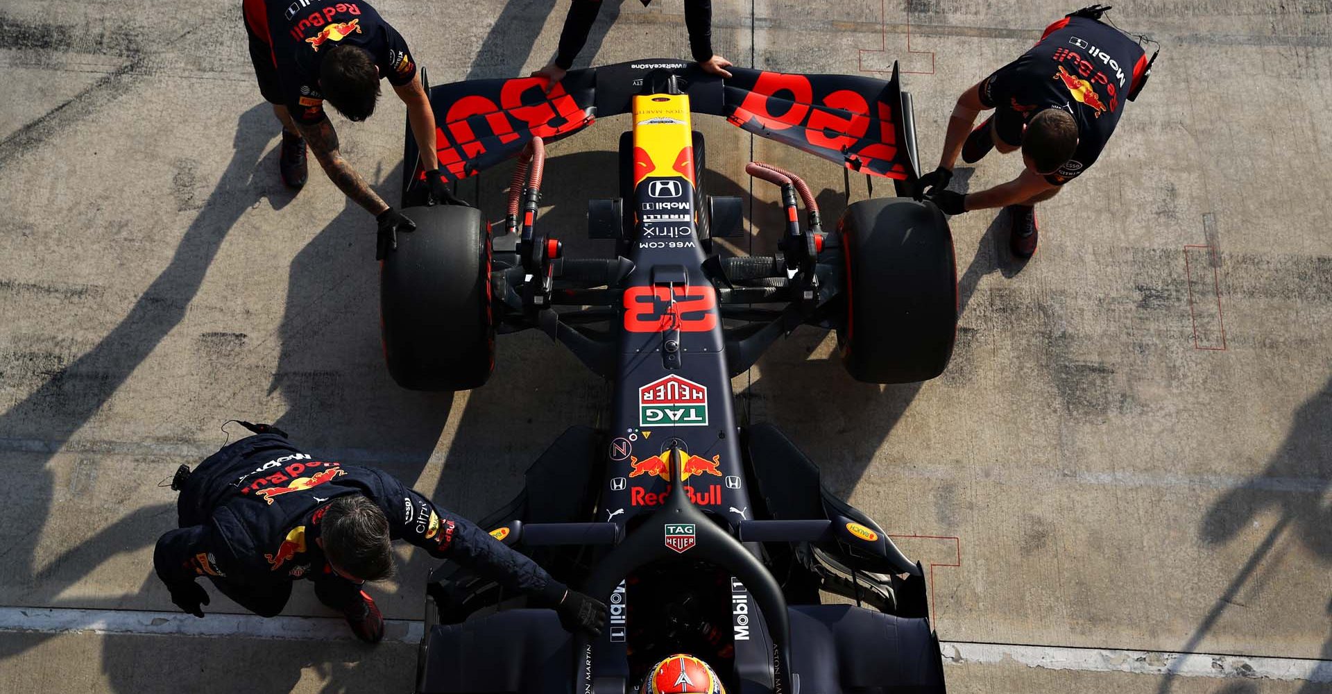 IMOLA, ITALY - OCTOBER 31: Alexander Albon of Thailand driving the (23) Aston Martin Red Bull Racing RB16 is pushed back into the garage during qualifying ahead of the F1 Grand Prix of Emilia Romagna at Autodromo Enzo e Dino Ferrari on October 31, 2020 in Imola, Italy. (Photo by Mark Thompson/Getty Images)