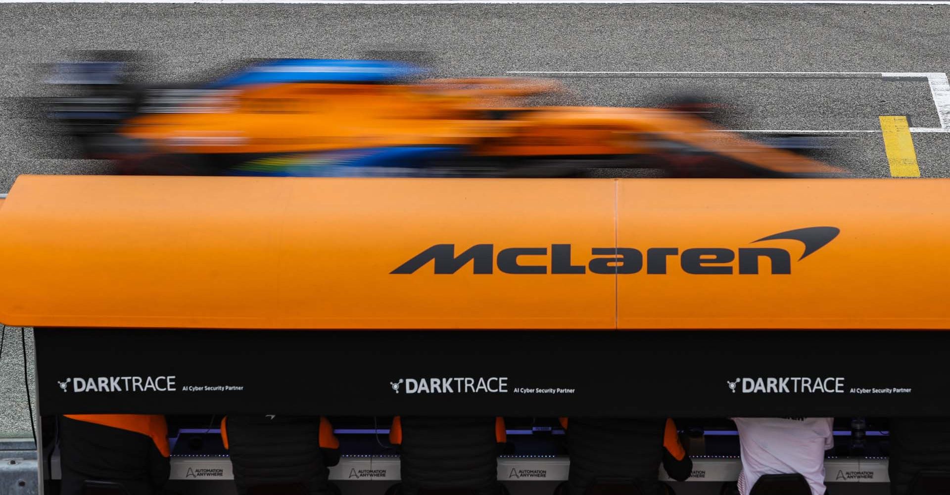 Carlos Sainz, McLaren MCL35, passes the McLaren pit wall