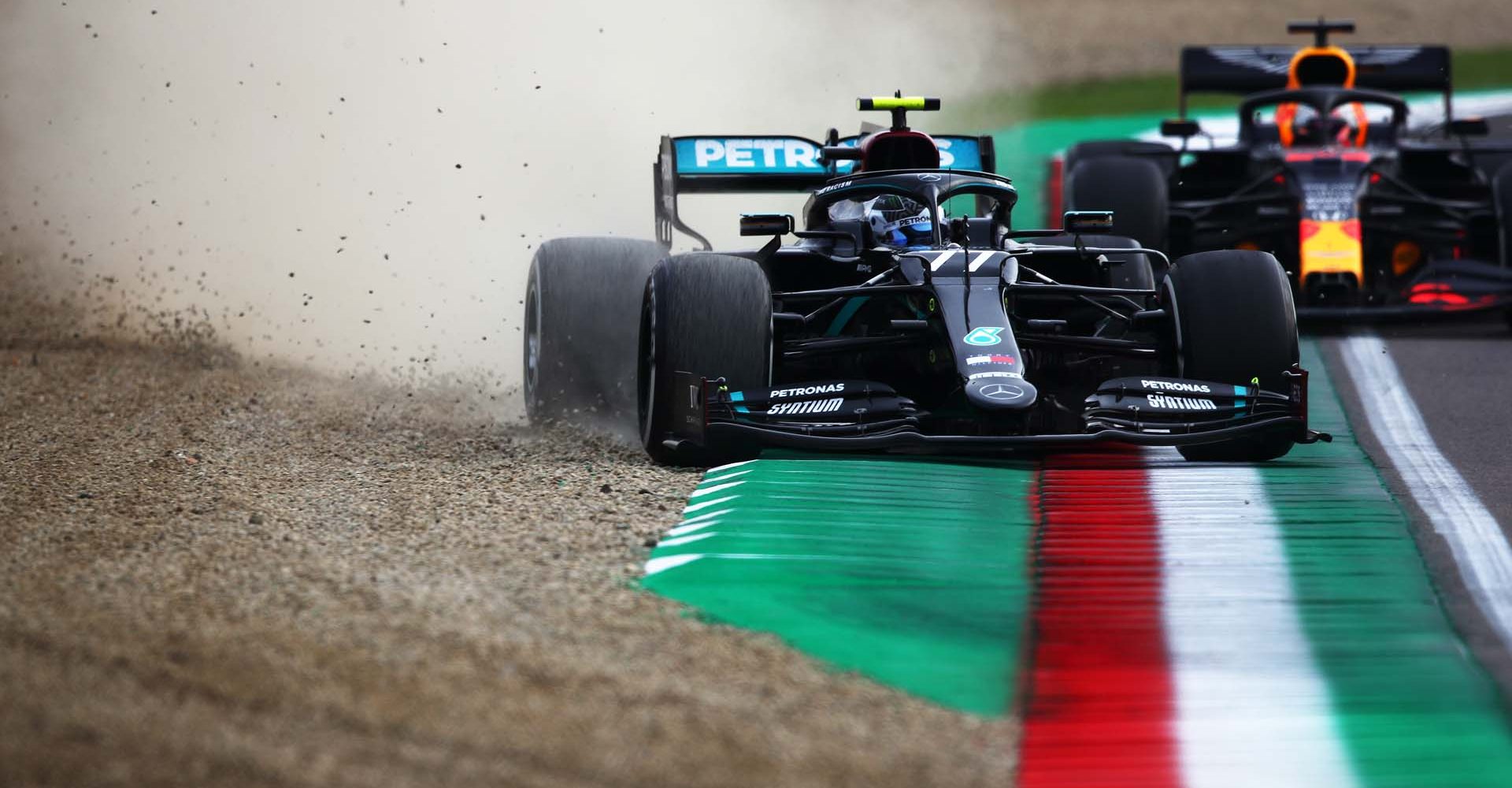 IMOLA, ITALY - NOVEMBER 01: Valtteri Bottas of Finland driving the (77) Mercedes AMG Petronas F1 Team Mercedes W11 leads Max Verstappen of the Netherlands driving the (33) Aston Martin Red Bull Racing RB16 on track during the F1 Grand Prix of Emilia Romagna at Autodromo Enzo e Dino Ferrari on November 01, 2020 in Imola, Italy. (Photo by Joe Portlock/Getty Images)