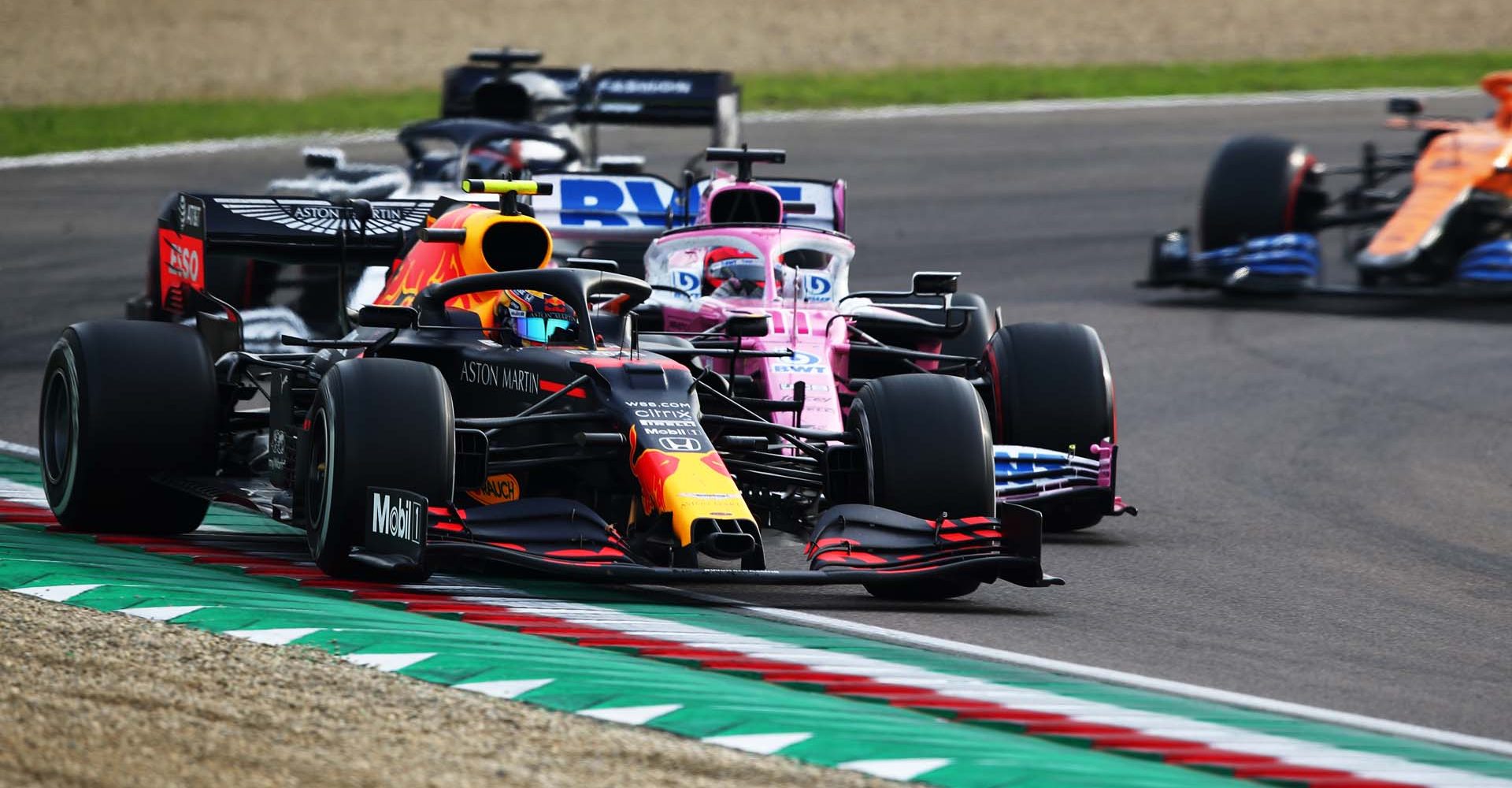 IMOLA, ITALY - NOVEMBER 01: Alexander Albon of Thailand driving the (23) Aston Martin Red Bull Racing RB16 leads a line of cars during the F1 Grand Prix of Emilia Romagna at Autodromo Enzo e Dino Ferrari on November 01, 2020 in Imola, Italy. (Photo by Joe Portlock/Getty Images)