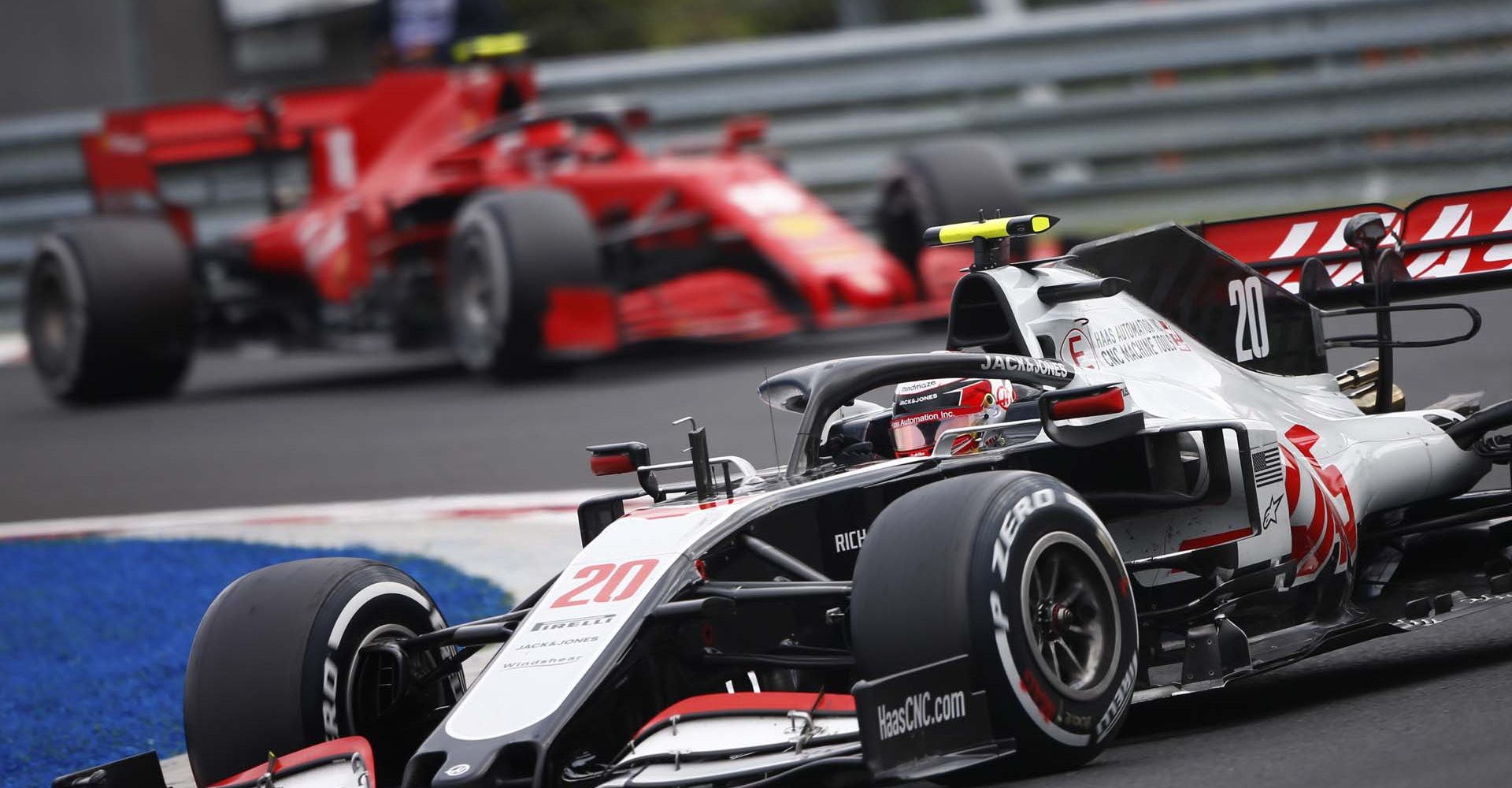 HUNGARORING, HUNGARY - JULY 19: Kevin Magnussen, Haas VF-20, leads Charles Leclerc, Ferrari SF1000 during the Hungarian GP at Hungaroring on Sunday July 19, 2020 in Budapest, Hungary. (Photo by Andy Hone / LAT Images)