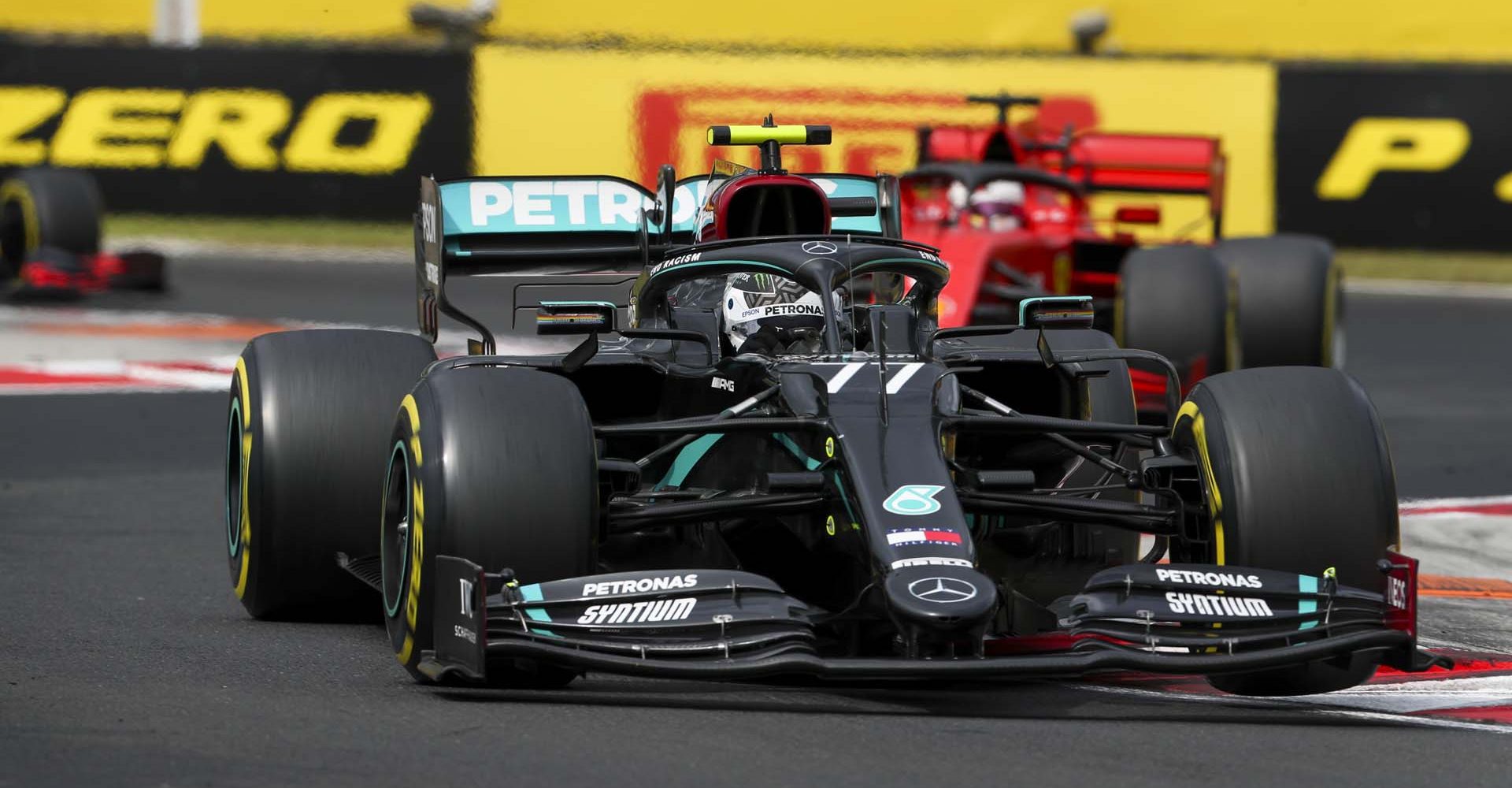 HUNGARORING, HUNGARY - JULY 19: Valtteri Bottas, Mercedes F1 W11 EQ Performance, leads Sebastian Vettel, Ferrari SF1000 during the Hungarian GP at Hungaroring on Sunday July 19, 2020 in Budapest, Hungary. (Photo by Charles Coates / LAT Images)