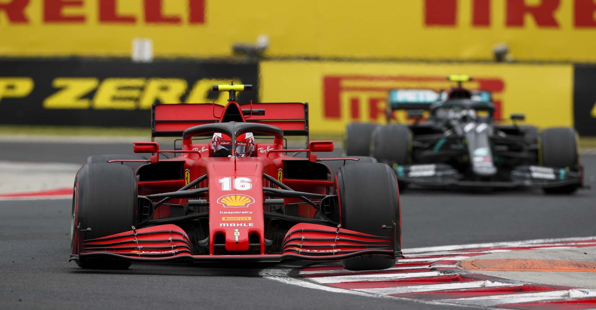 HUNGARORING, HUNGARY - JULY 19: Charles Leclerc, Ferrari SF1000, leads Valtteri Bottas, Mercedes F1 W11 EQ Performance during the Hungarian GP at Hungaroring on Sunday July 19, 2020 in Budapest, Hungary. (Photo by Charles Coates / LAT Images)