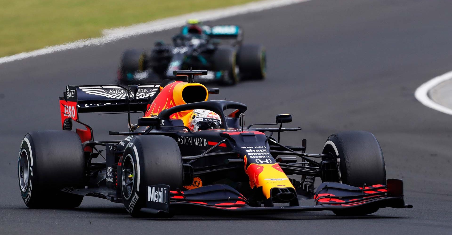 BUDAPEST, HUNGARY - JULY 19: Max Verstappen of the Netherlands driving the (33) Aston Martin Red Bull Racing RB16 leads Valtteri Bottas of Finland driving the (77) Mercedes AMG Petronas F1 Team Mercedes W11 during the Formula One Grand Prix of Hungary at Hungaroring on July 19, 2020 in Budapest, Hungary. (Photo by Darko Bandic/Pool via Getty Images) // Getty Images / Red Bull Content Pool  // AP-24P72V1212111 // Usage for editorial use only //