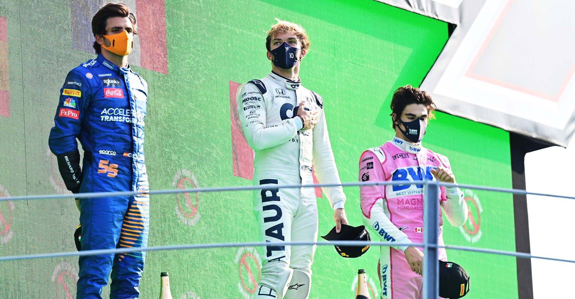 MONZA, ITALY - SEPTEMBER 06: Race winner Pierre Gasly of France and Scuderia AlphaTauri, second placed Carlos Sainz of Spain and McLaren F1 and third placed Lance Stroll of Canada and Racing Point celebrate on the podium during the F1 Grand Prix of Italy at Autodromo di Monza on September 06, 2020 in Monza, Italy. (Photo by Miguel Medina - Pool/Getty Images)