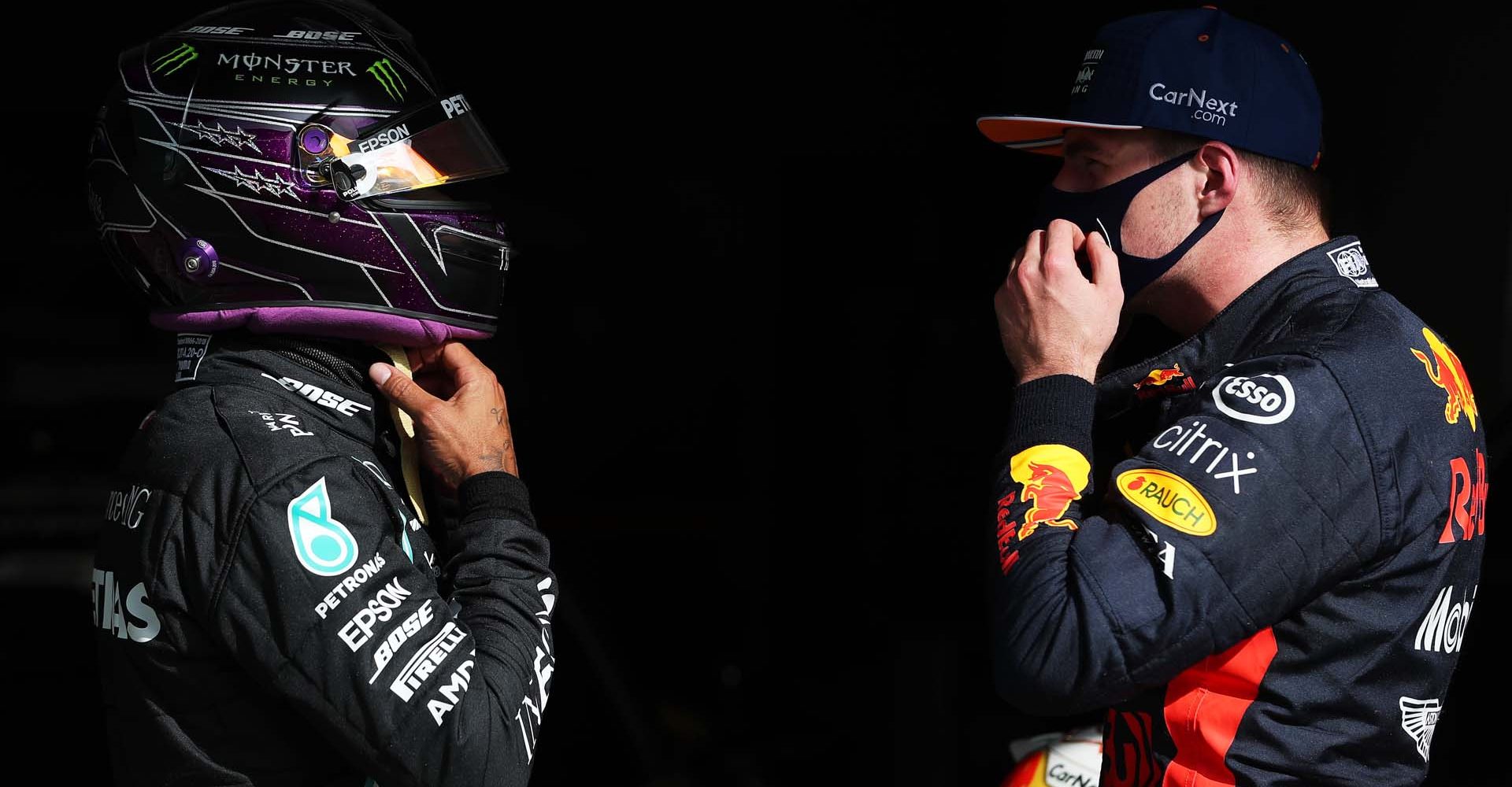 PORTIMAO, PORTUGAL - OCTOBER 24: Pole position qualifier Lewis Hamilton of Great Britain and Mercedes GP speaks with third placed Max Verstappen of Netherlands and Red Bull Racing in parc ferme during qualifying ahead of the F1 Grand Prix of Portugal at Autodromo Internacional do Algarve on October 24, 2020 in Portimao, Portugal. (Photo by Jose Sena Goulao - Pool/Getty Images)