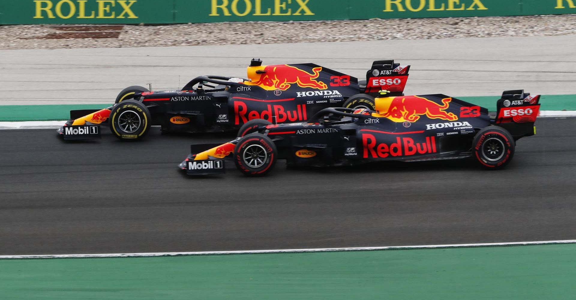 PORTIMAO, PORTUGAL - OCTOBER 25: Max Verstappen of the Netherlands driving the (33) Aston Martin Red Bull Racing RB16 and Alexander Albon of Thailand driving the (23) Aston Martin Red Bull Racing RB16 battle for position on track during the F1 Grand Prix of Portugal at Autodromo Internacional do Algarve on October 25, 2020 in Portimao, Portugal. (Photo by Armando Franca - Pool/Getty Images)