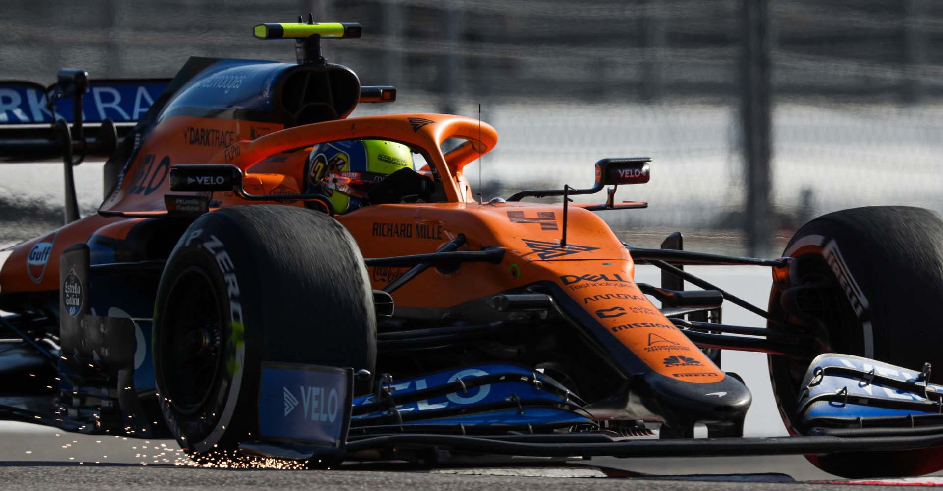 Sparks fly from the front wing of Lando Norris, McLaren MCL35