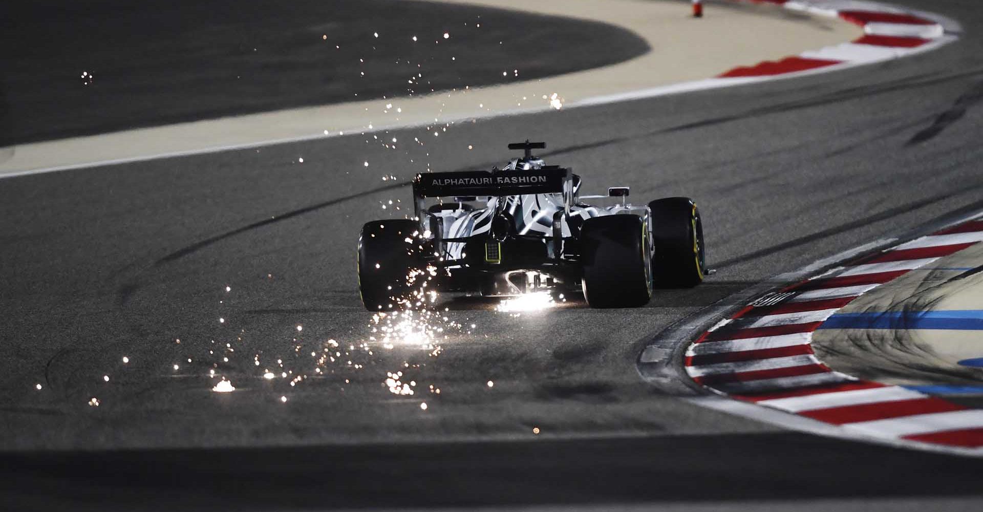 BAHRAIN, BAHRAIN - DECEMBER 04: Sparks fly behind Daniil Kvyat of Russia driving the (26) Scuderia AlphaTauri AT01 Honda during practice ahead of the F1 Grand Prix of Sakhir at Bahrain International Circuit on December 04, 2020 in Bahrain, Bahrain. (Photo by Rudy Carezzevoli/Getty Images)