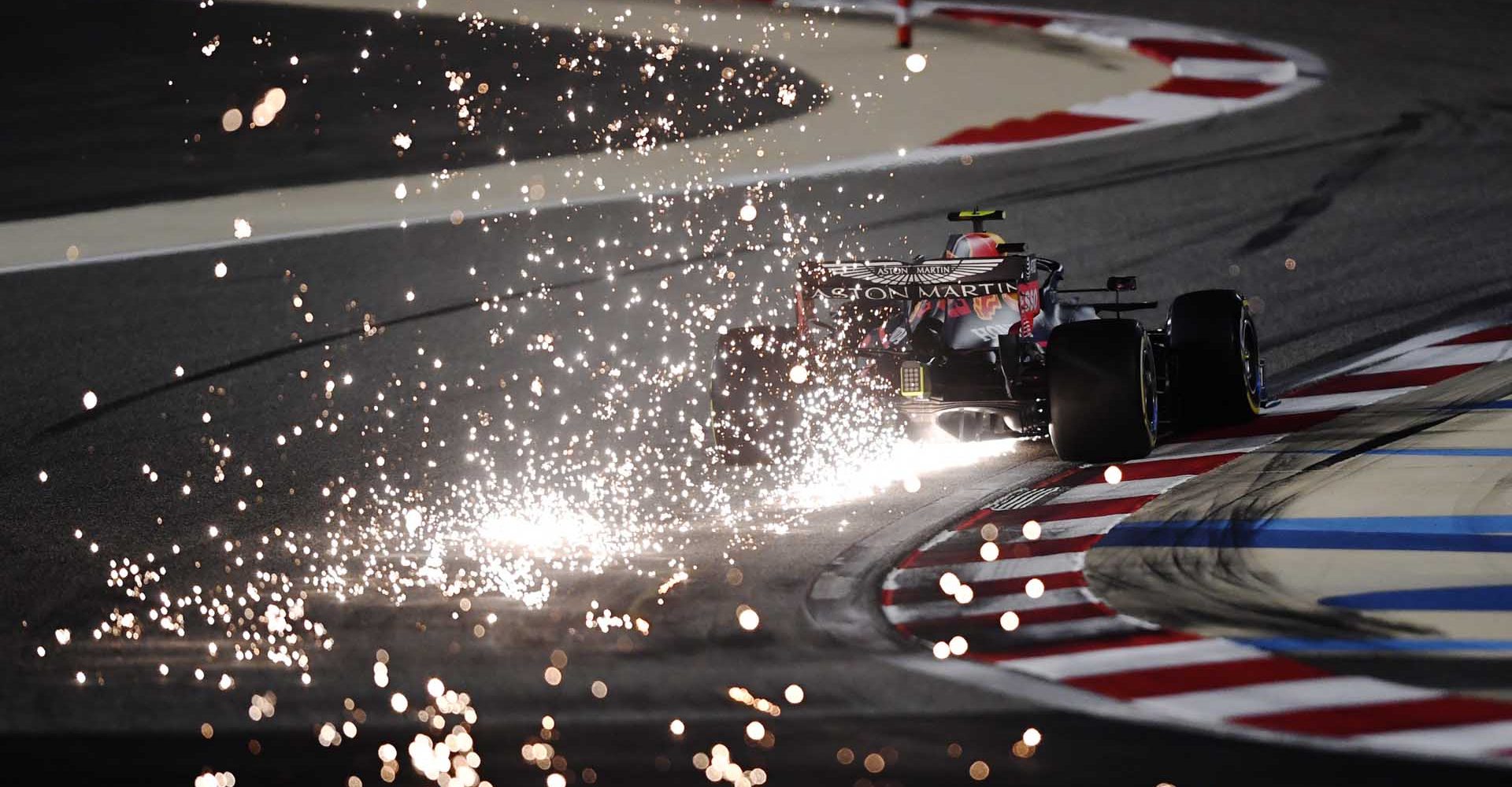 BAHRAIN, BAHRAIN - DECEMBER 04: Sparks fly behind Alexander Albon of Thailand driving the (23) Aston Martin Red Bull Racing RB16 during practice ahead of the F1 Grand Prix of Sakhir at Bahrain International Circuit on December 04, 2020 in Bahrain, Bahrain. (Photo by Rudy Carezzevoli/Getty Images) beauty