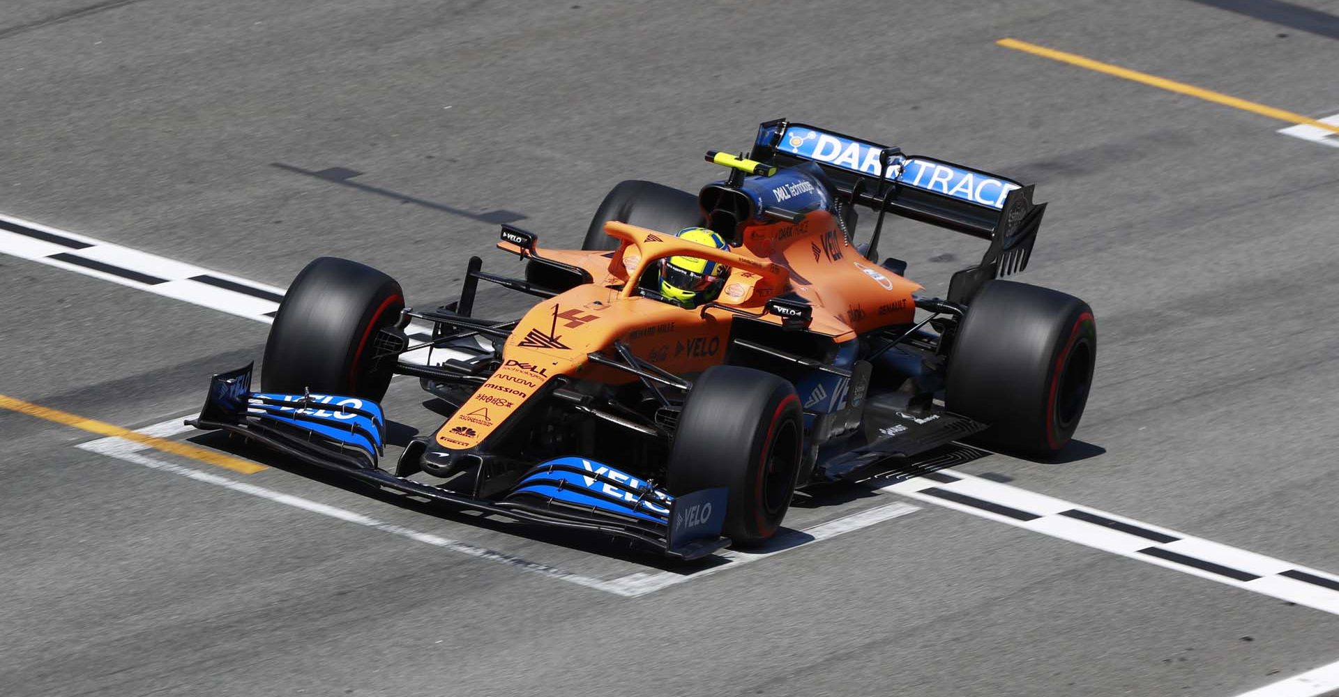 Lando Norris, McLaren MCL35, on the pit straight