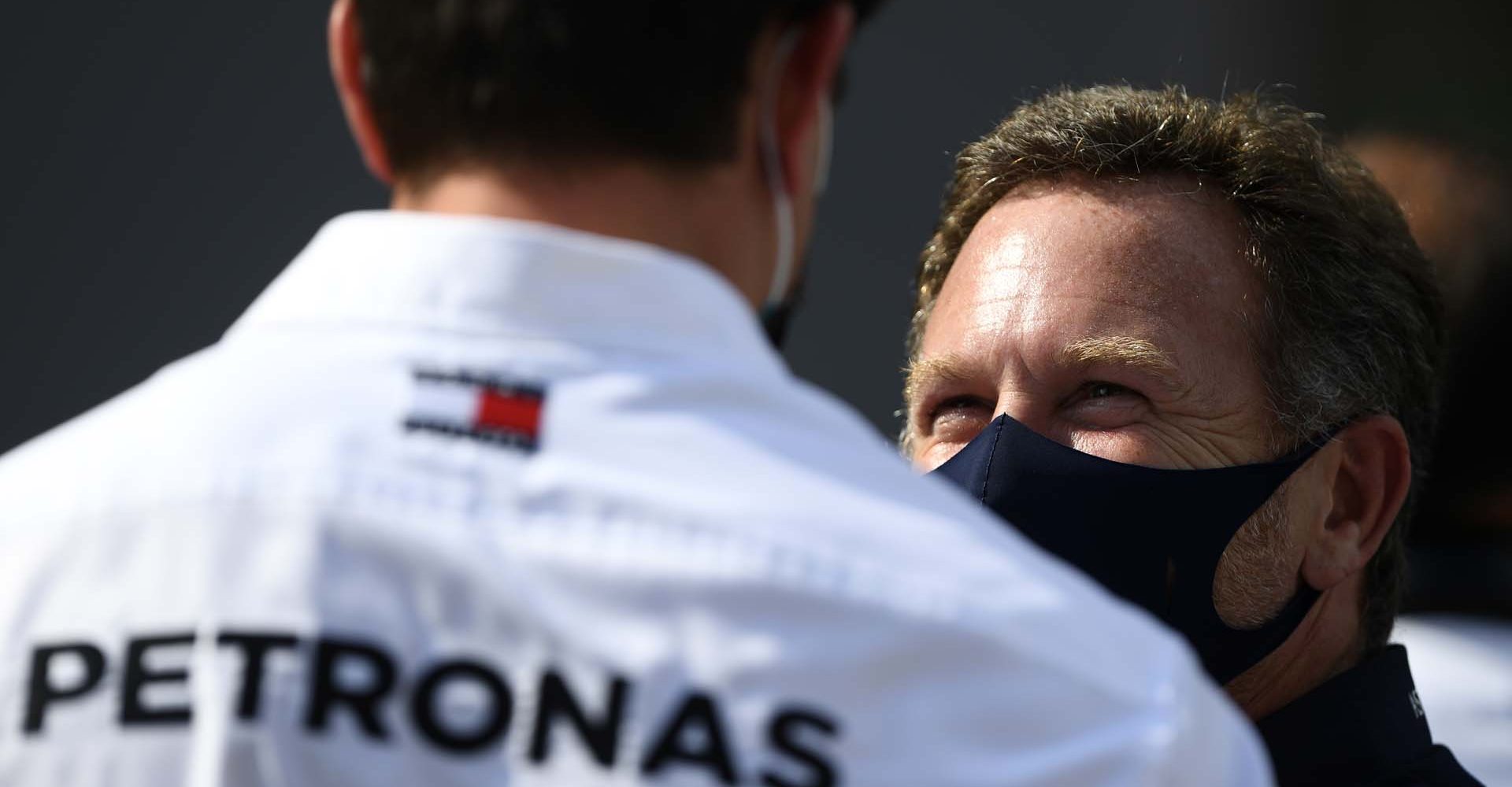 BARCELONA, SPAIN - AUGUST 16: Red Bull Racing Team Principal Christian Horner talks to Mercedes GP Executive Director Toto Wolff during the F1 Grand Prix of Spain at Circuit de Barcelona-Catalunya on August 16, 2020 in Barcelona, Spain. (Photo by Rudy Carezzevoli/Getty Images)