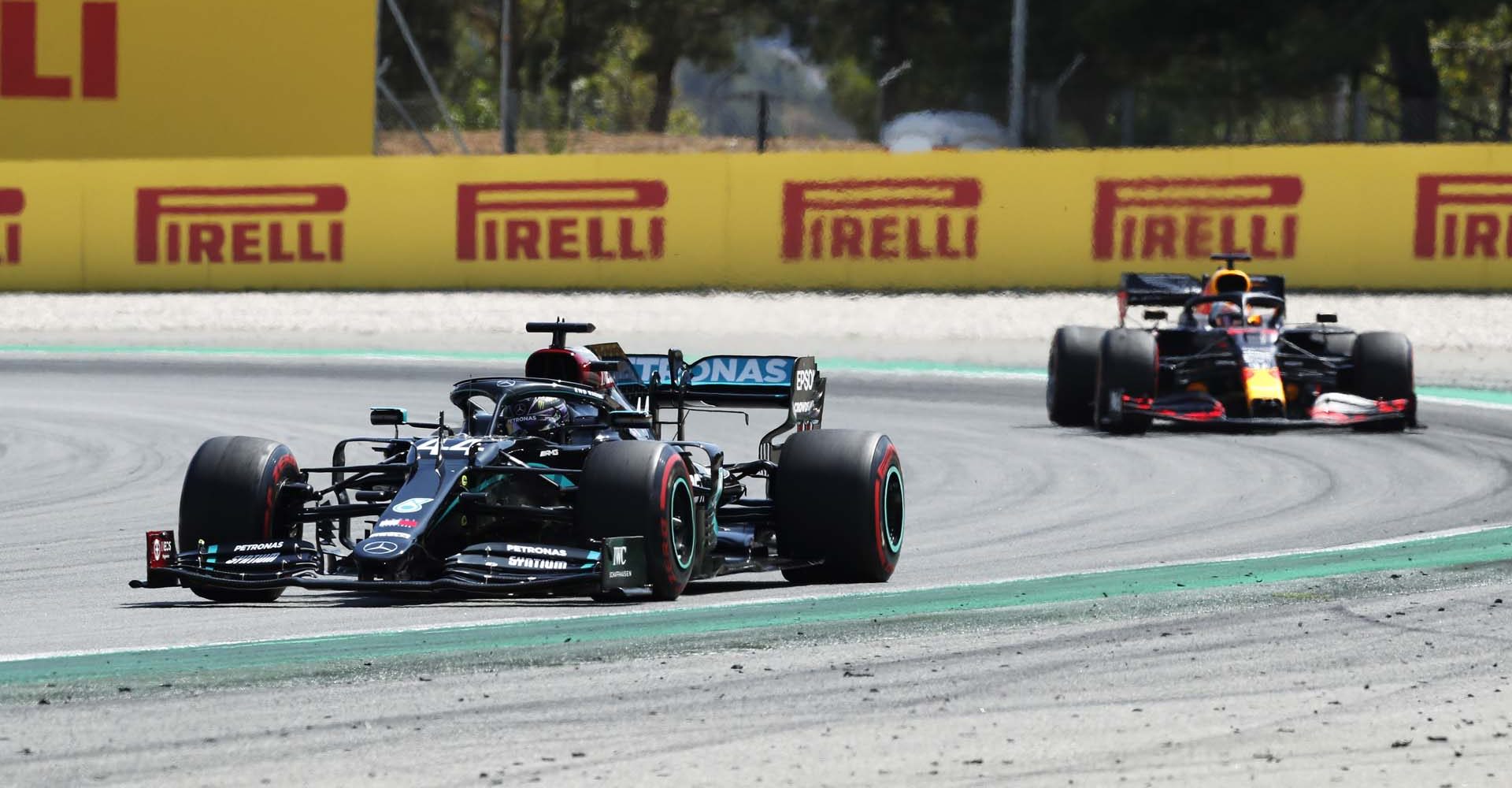 BARCELONA, SPAIN - AUGUST 16: Lewis Hamilton of Great Britain driving the (44) Mercedes AMG Petronas F1 Team Mercedes W11 leads Max Verstappen of the Netherlands driving the (33) Aston Martin Red Bull Racing RB16 during the F1 Grand Prix of Spain at Circuit de Barcelona-Catalunya on August 16, 2020 in Barcelona, Spain. (Photo by Albert Gea/Pool via Getty Images)