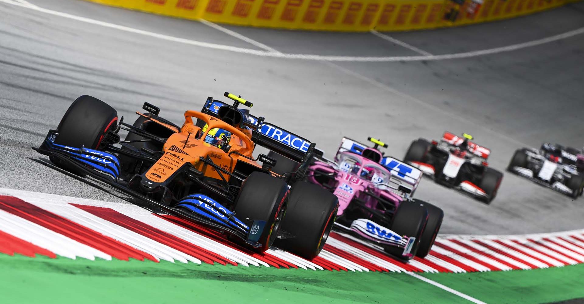 RED BULL RING, AUSTRIA - JULY 12: Lando Norris, McLaren MCL35, Lance Stroll, Racing Point RP20 during the Styrian GP at Red Bull Ring on Sunday July 12, 2020 in Spielberg, Austria. (Photo by Mark Sutton / LAT Images)