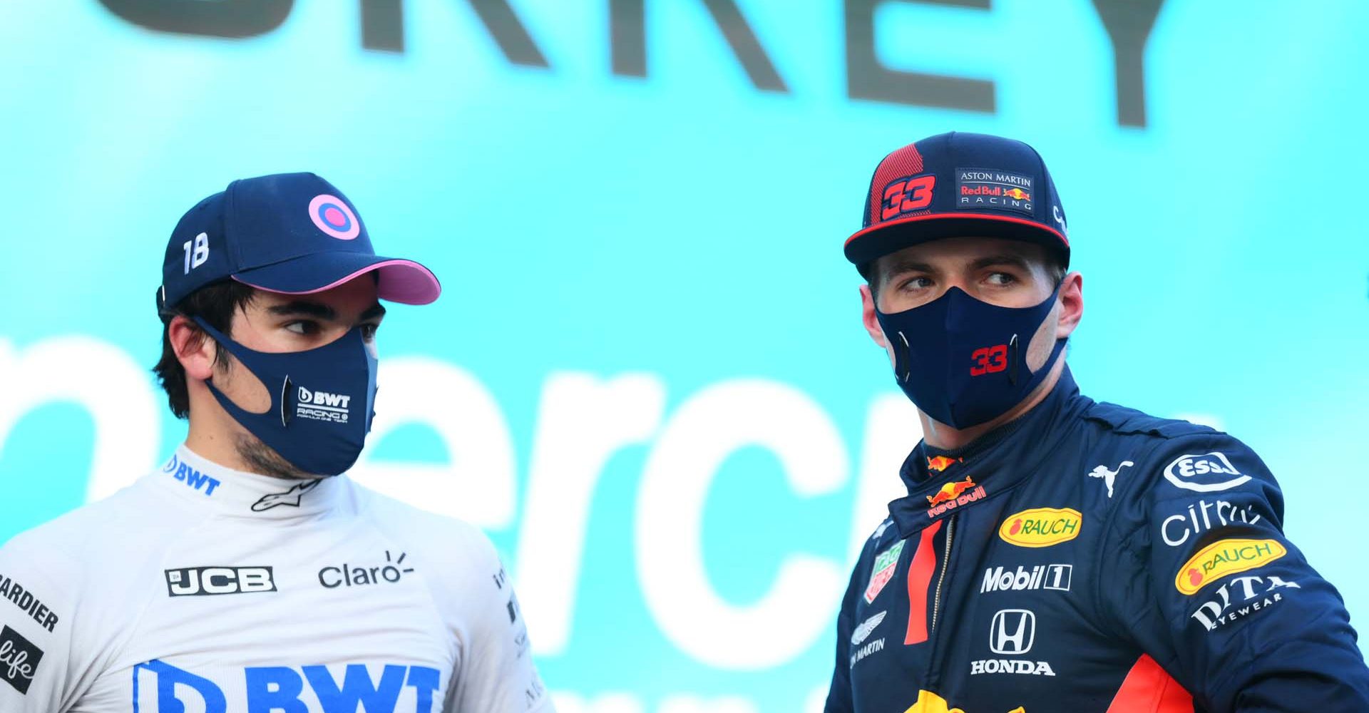 ISTANBUL, TURKEY - NOVEMBER 14: Pole position qualifier Lance Stroll of Canada and Racing Point speaks with second placed qualifier Max Verstappen of Netherlands and Red Bull Racing in parc ferme during qualifying ahead of the F1 Grand Prix of Turkey at Intercity Istanbul Park on November 14, 2020 in Istanbul, Turkey. (Photo by Clive Mason/Getty Images)