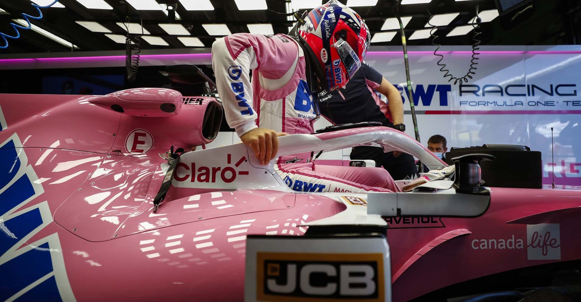 Sergio Perez, Racing Point, climbs into his cockpit