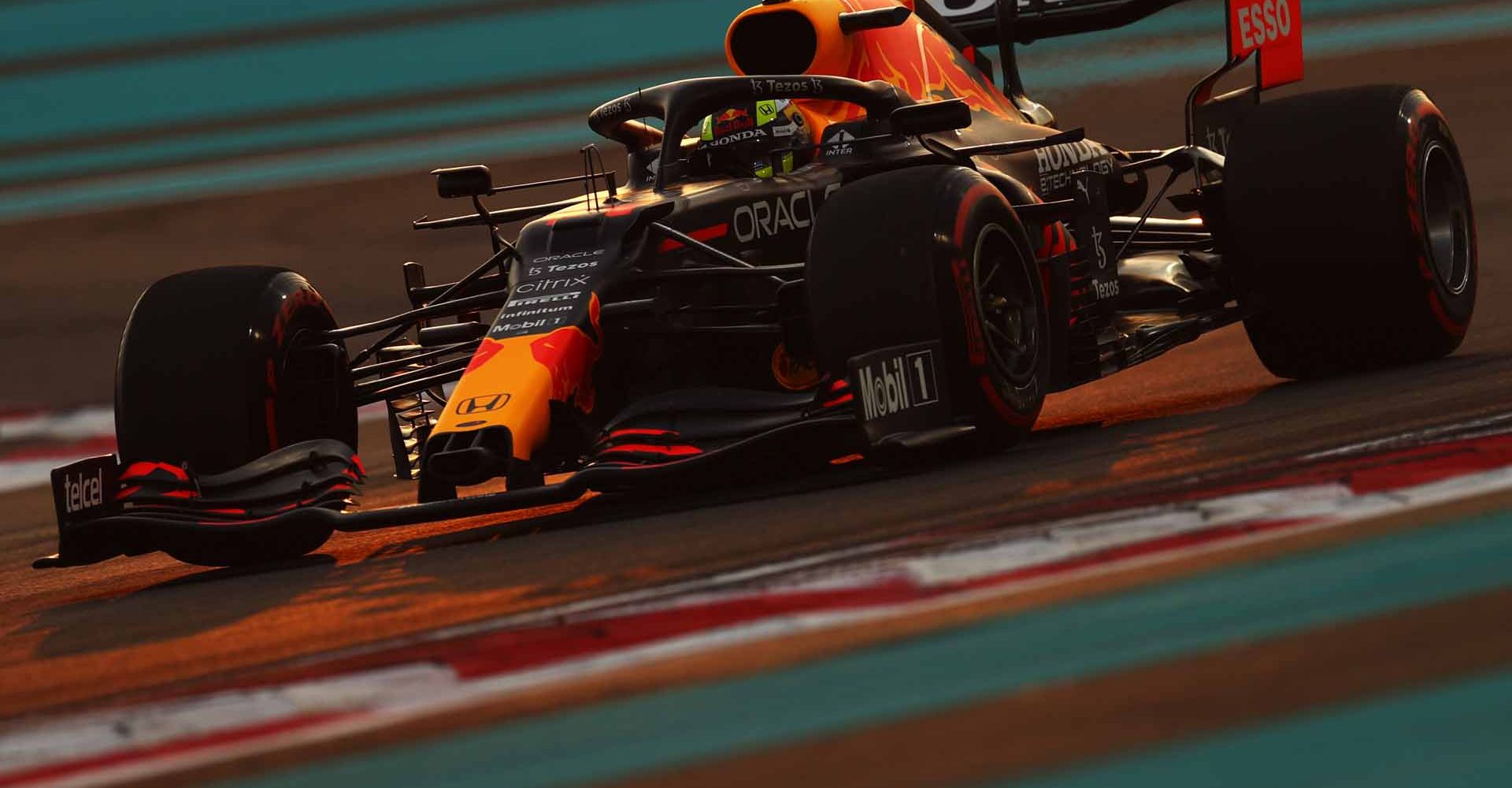 ABU DHABI, UNITED ARAB EMIRATES - DECEMBER 11: Sergio Perez of Mexico driving the (11) Red Bull Racing RB16B Honda during qualifying ahead of the F1 Grand Prix of Abu Dhabi at Yas Marina Circuit on December 11, 2021 in Abu Dhabi, United Arab Emirates. (Photo by Clive Rose/Getty Images)