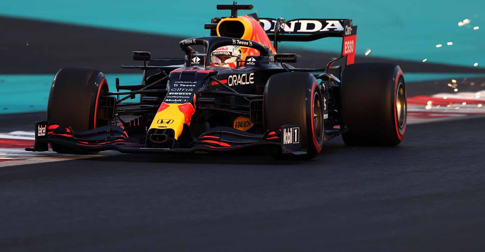 ABU DHABI, UNITED ARAB EMIRATES - DECEMBER 11: Sparks fly behind Max Verstappen of the Netherlands driving the (33) Red Bull Racing RB16B Honda during qualifying ahead of the F1 Grand Prix of Abu Dhabi at Yas Marina Circuit on December 11, 2021 in Abu Dhabi, United Arab Emirates. (Photo by Lars Baron/Getty Images)