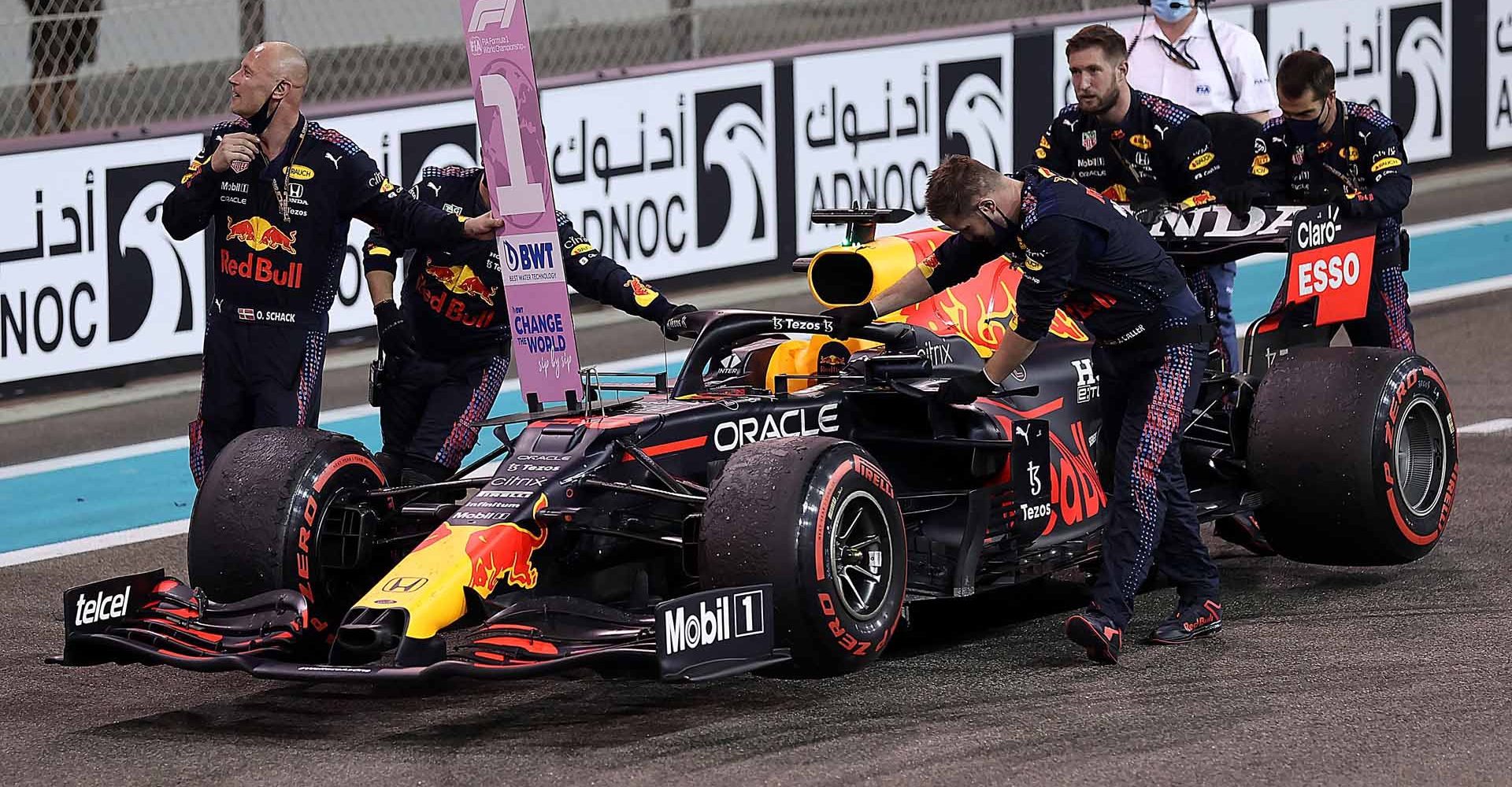 ABU DHABI, UNITED ARAB EMIRATES - DECEMBER 12: The team of Max Verstappen of Netherlands and Red Bull Racing celebrate after he won the race and the F1 World Drivers Championship during the F1 Grand Prix of Abu Dhabi at Yas Marina Circuit on December 12, 2021 in Abu Dhabi, United Arab Emirates. (Photo by Lars Baron/Getty Images)