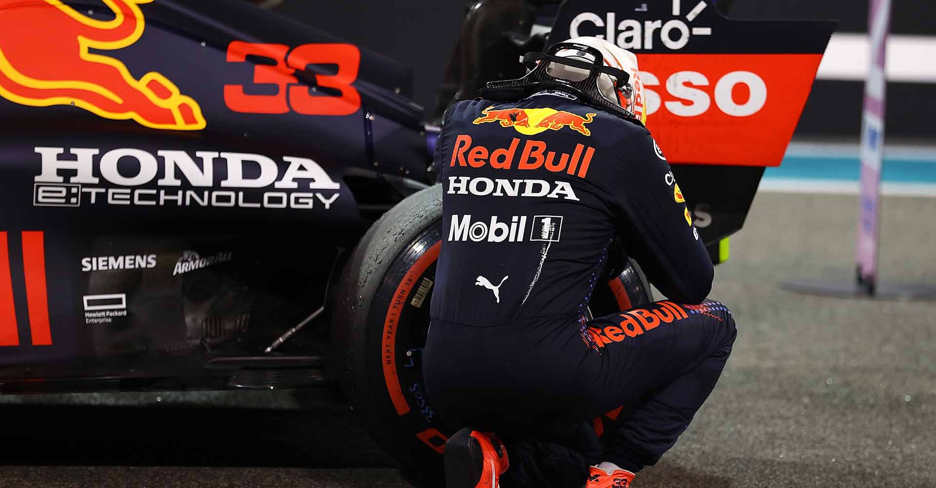 ABU DHABI, UNITED ARAB EMIRATES - DECEMBER 12: Race winner and 2021 F1 World Drivers Champion Max Verstappen of Netherlands and Red Bull Racing celebrates in parc ferme during the F1 Grand Prix of Abu Dhabi at Yas Marina Circuit on December 12, 2021 in Abu Dhabi, United Arab Emirates. (Photo by Bryn Lennon/Getty Images)