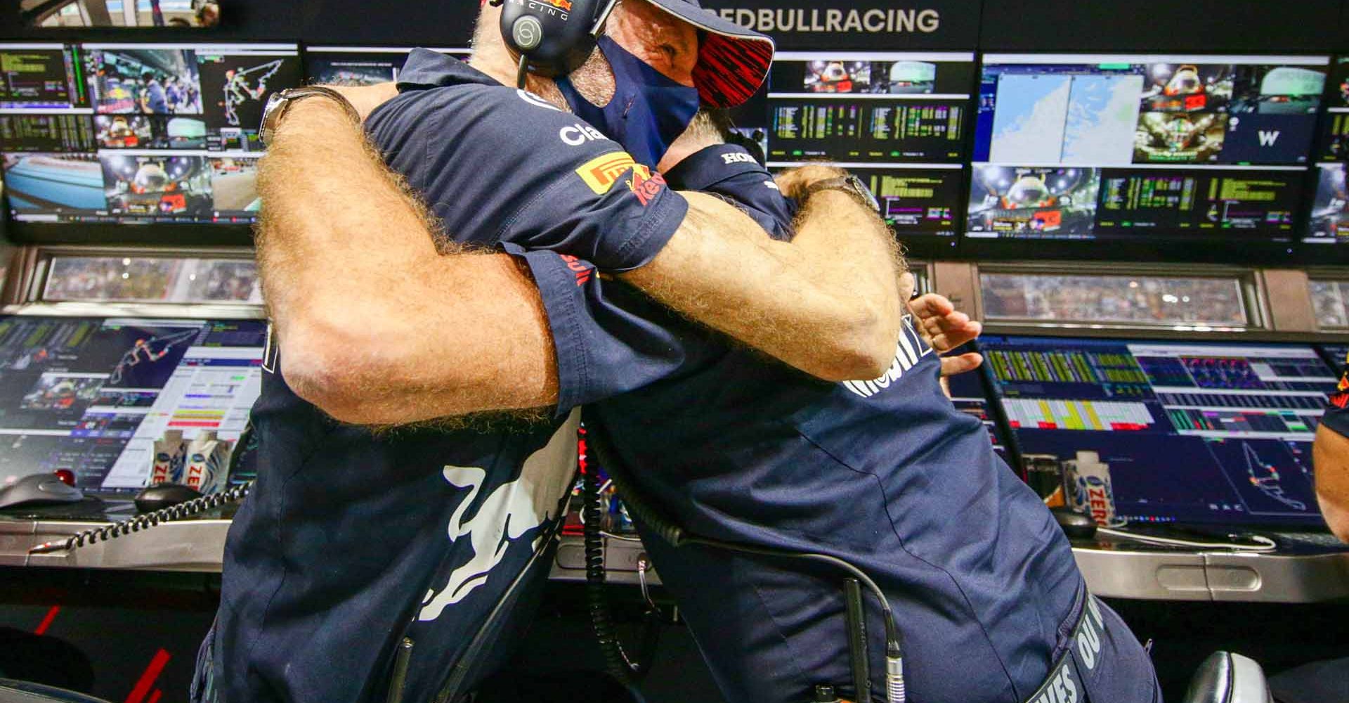 ABU DHABI, UNITED ARAB EMIRATES - DECEMBER 12: Adrian Newey and Christian Horner of Great Britain and Red Bull Racing celebrate Max Verstappen winning the F1 Grand Prix of Abu Dhabi at Yas Marina Circuit on December 12, 2021 in Abu Dhabi, United Arab Emirates. (Photo by Peter Fox/Getty Images)