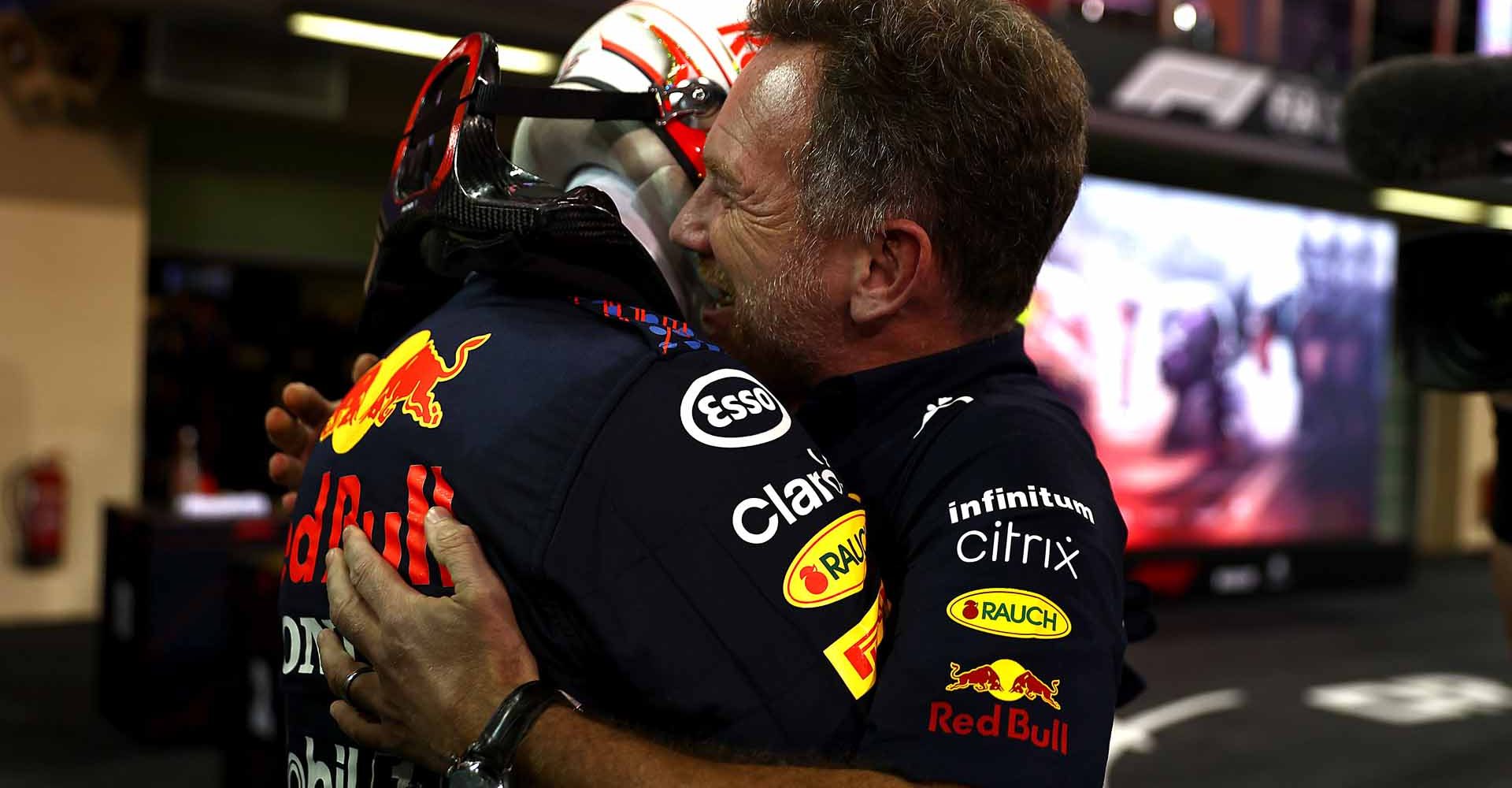 ABU DHABI, UNITED ARAB EMIRATES - DECEMBER 12: Race winner and 2021 F1 World Drivers Champion Max Verstappen of Netherlands and Red Bull Racing celebrates with Red Bull Racing Team Principal Christian Horner in parc ferme during the F1 Grand Prix of Abu Dhabi at Yas Marina Circuit on December 12, 2021 in Abu Dhabi, United Arab Emirates. (Photo by Mark Thompson/Getty Images)