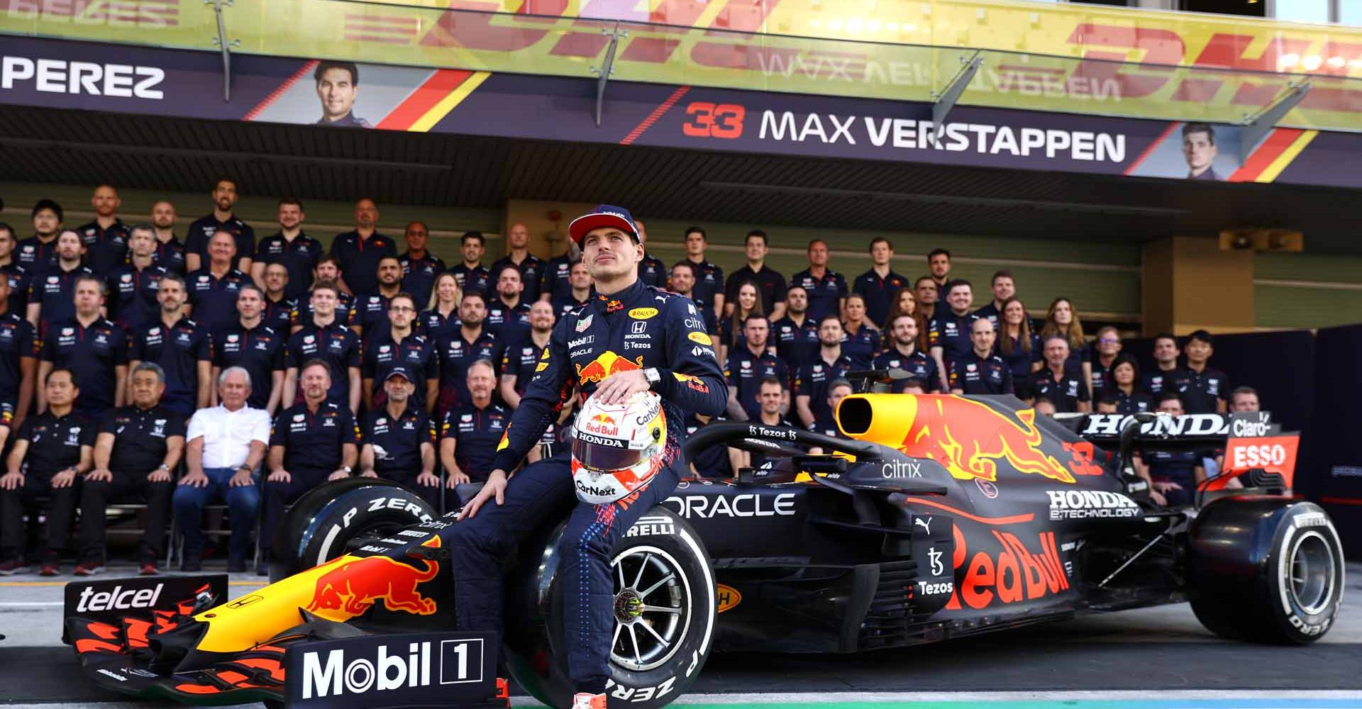 ABU DHABI, UNITED ARAB EMIRATES - DECEMBER 09: Max Verstappen of Netherlands and Red Bull Racing looks on at the Red Bull Racing team photo during previews ahead of the F1 Grand Prix of Abu Dhabi at Yas Marina Circuit on December 09, 2021 in Abu Dhabi, United Arab Emirates. (Photo by Bryn Lennon/Getty Images)