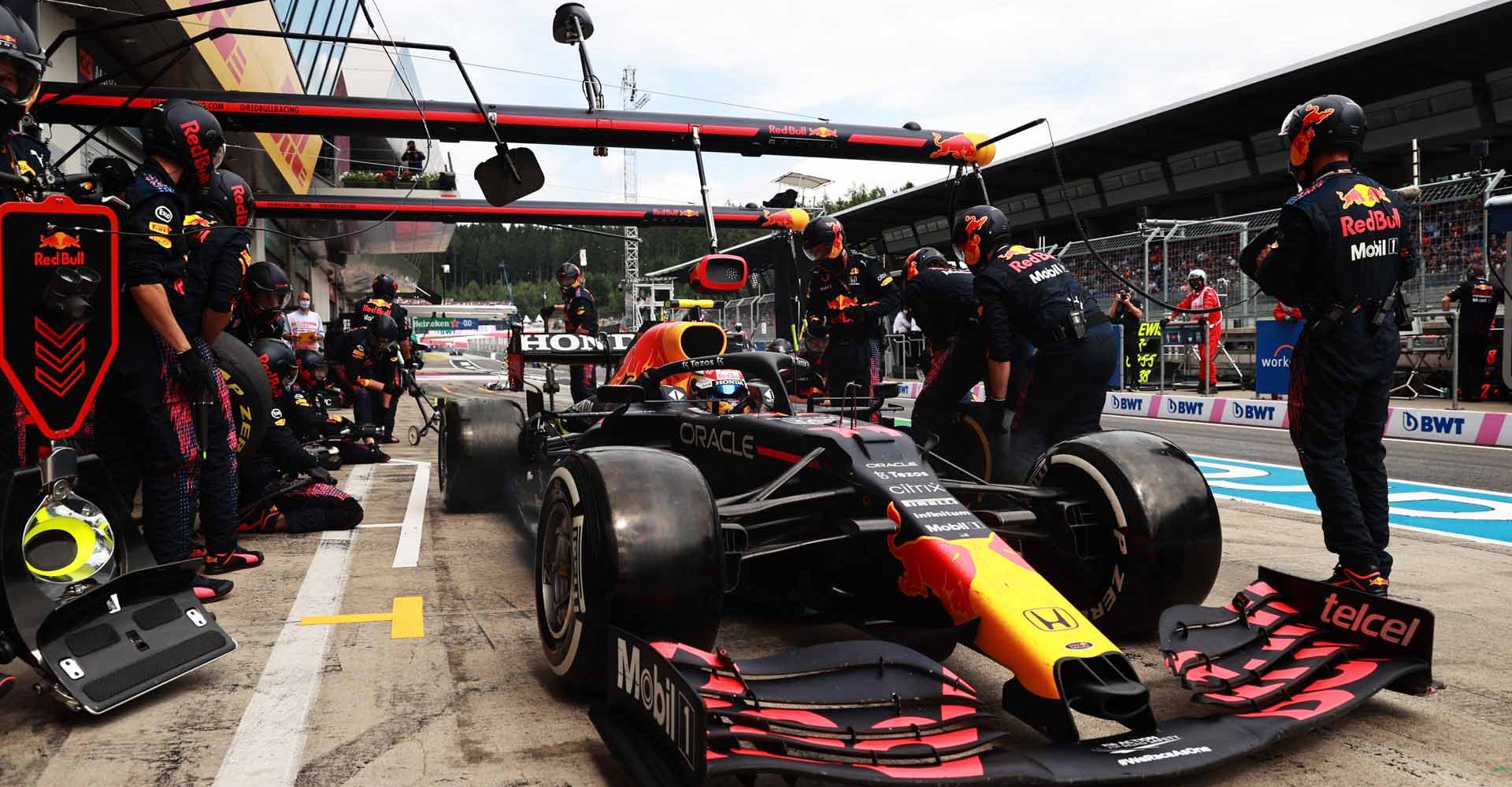 SPIELBERG, AUSTRIA - JULY 04: Sergio Perez of Mexico driving the (11) Red Bull Racing RB16B Honda makes a pitstop during the F1 Grand Prix of Austria at Red Bull Ring on July 04, 2021 in Spielberg, Austria. (Photo by Mark Thompson/Getty Images)