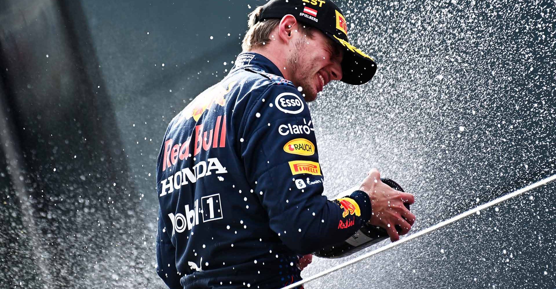 SPIELBERG, AUSTRIA - JULY 04: Race winner Max Verstappen of Netherlands and Red Bull Racing celebrates on the podium during the F1 Grand Prix of Austria at Red Bull Ring on July 04, 2021 in Spielberg, Austria. (Photo by Christian Bruna - Pool/Getty Images)