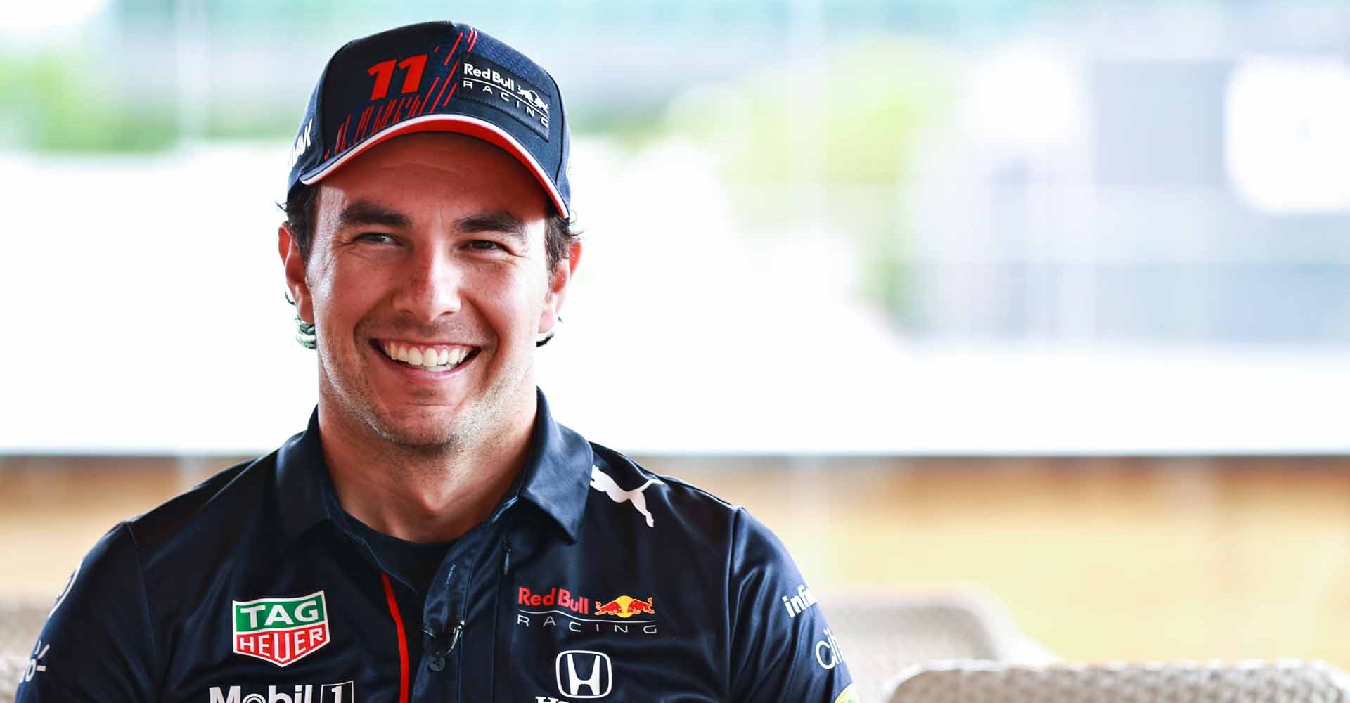 SPIELBERG, AUSTRIA - JULY 01: Sergio Perez of Mexico and Red Bull Racing talks in the Paddock during previews ahead of the F1 Grand Prix of Austria at Red Bull Ring on July 01, 2021 in Spielberg, Austria. (Photo by Mark Thompson/Getty Images)