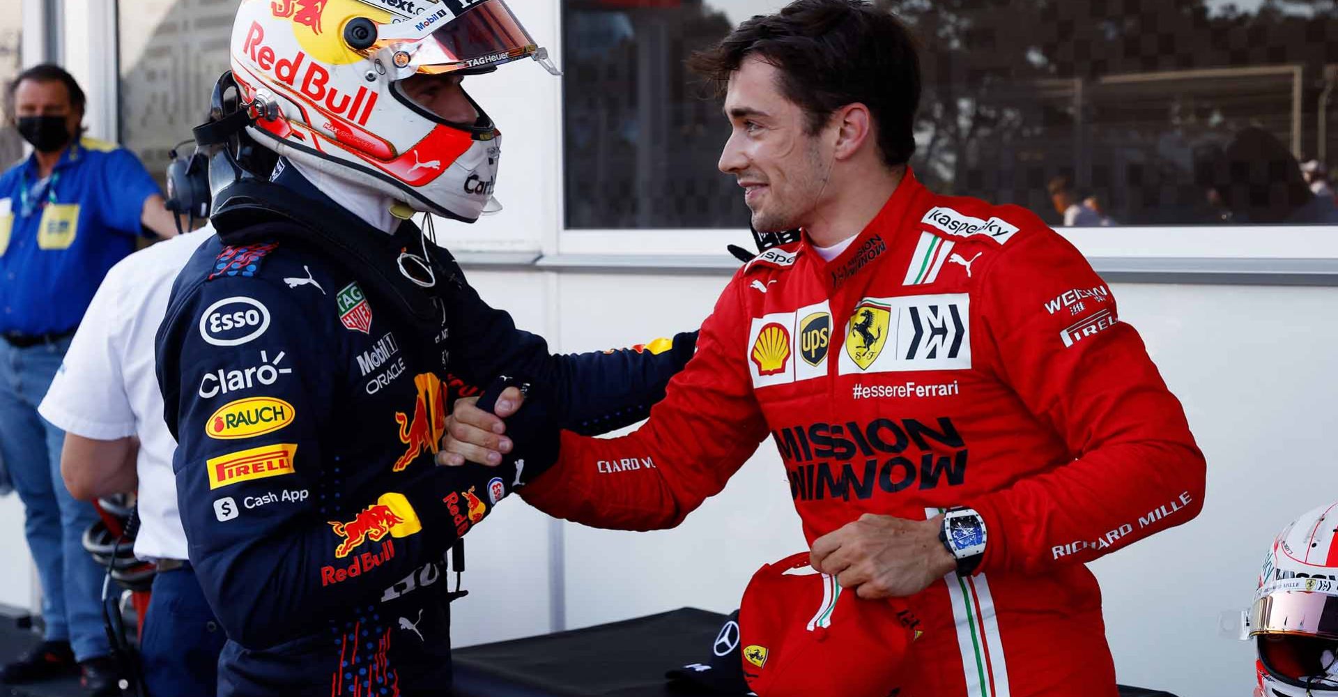 BAKU, AZERBAIJAN - JUNE 05: Third placed qualifier Max Verstappen of Netherlands and Red Bull Racing shakes hands with pole position qualifier Charles Leclerc of Monaco and Ferrari in parc ferme during qualifying ahead of the F1 Grand Prix of Azerbaijan at Baku City Circuit on June 05, 2021 in Baku, Azerbaijan. (Photo by Maxim Shemetov - Pool/Getty Images)