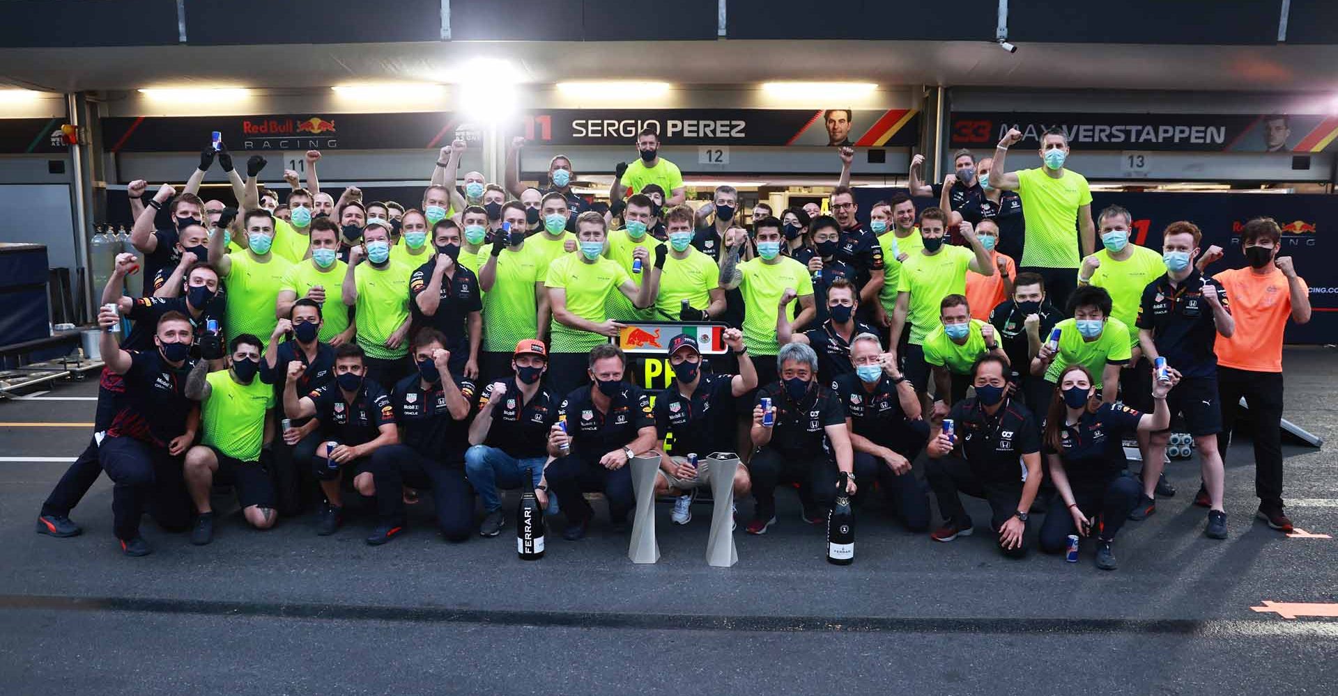 BAKU, AZERBAIJAN - JUNE 06: Race winner Sergio Perez of Mexico and Red Bull Racing celebrates with his team after the F1 Grand Prix of Azerbaijan at Baku City Circuit on June 06, 2021 in Baku, Azerbaijan. (Photo by Mark Thompson/Getty Images)