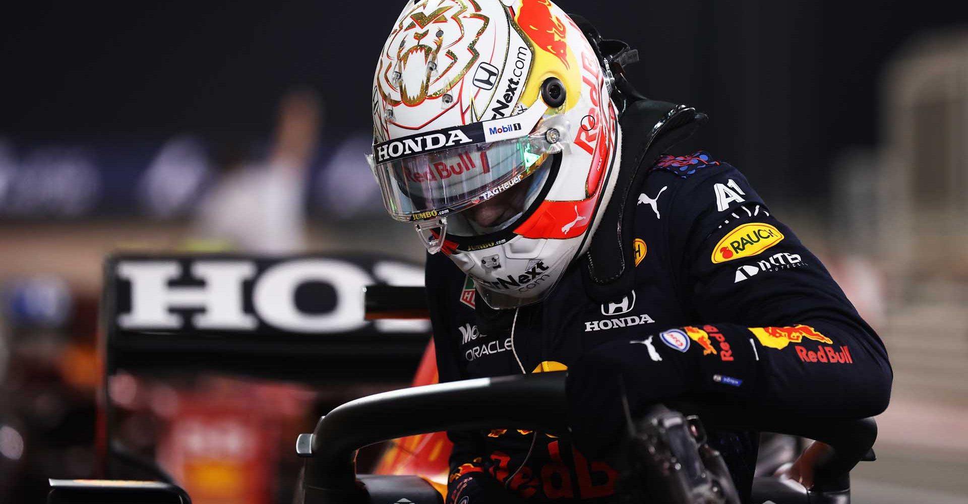 BAHRAIN, BAHRAIN - MARCH 27: Pole position qualifier Max Verstappen of Netherlands and Red Bull Racing climbs out of his car in parc ferme during qualifying ahead of the F1 Grand Prix of Bahrain at Bahrain International Circuit on March 27, 2021 in Bahrain, Bahrain. (Photo by Lars Baron/Getty Images)