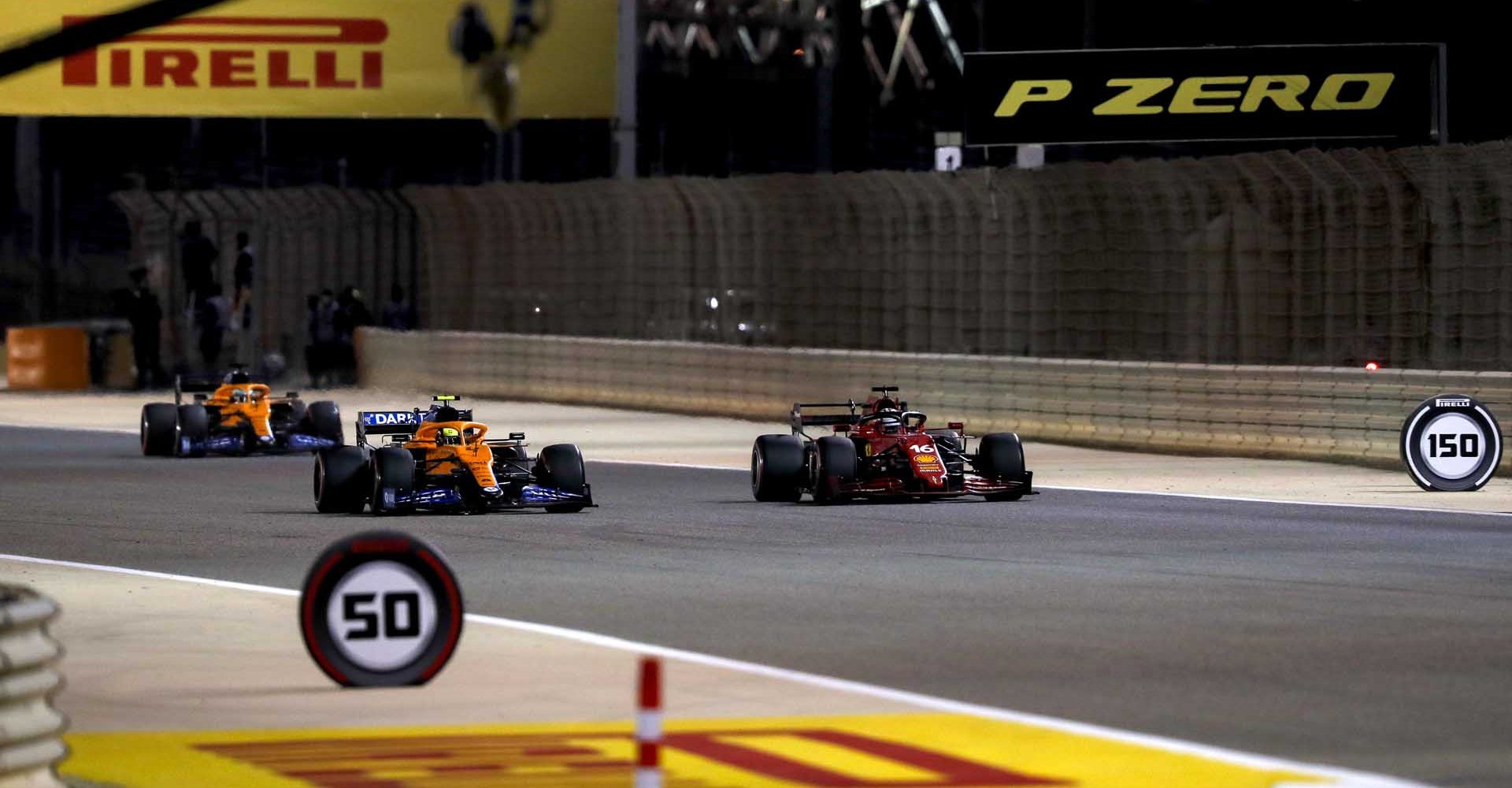 BAHRAIN INTERNATIONAL CIRCUIT, BAHRAIN - MARCH 28: Charles Leclerc, Ferrari SF21, leads Lando Norris, McLaren MCL35M, and Daniel Ricciardo, McLaren MCL35M during the Bahrain GP at Bahrain International Circuit on Sunday March 28, 2021 in Sakhir, Bahrain. (Photo by Charles Coates / LAT Images)