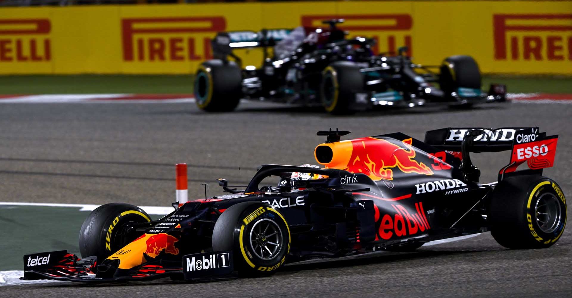 BAHRAIN INTERNATIONAL CIRCUIT, BAHRAIN - MARCH 28: Max Verstappen, Red Bull Racing RB16B, leads Sir Lewis Hamilton, Mercedes W12 during the Bahrain GP at Bahrain International Circuit on Sunday March 28, 2021 in Sakhir, Bahrain. (Photo by Mark Sutton / LAT Images)