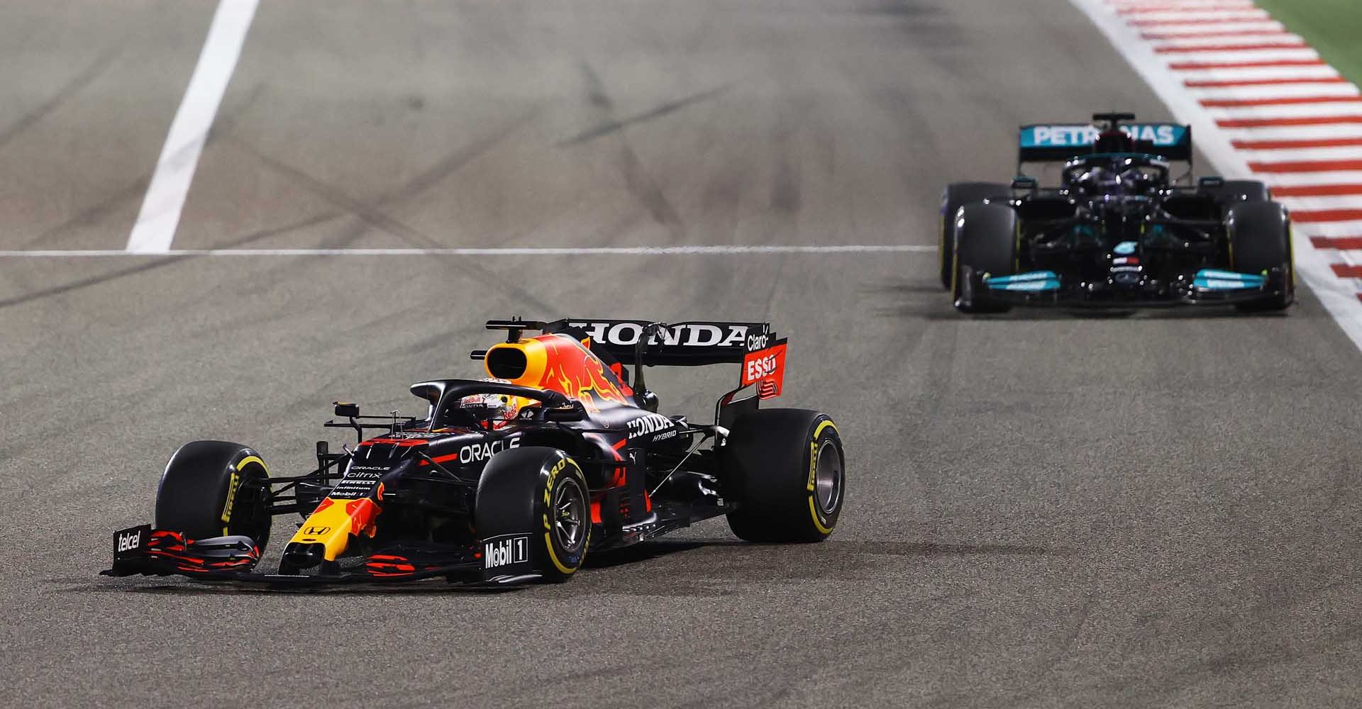 BAHRAIN, BAHRAIN - MARCH 28: Max Verstappen of the Netherlands driving the (33) Red Bull Racing RB16B Honda leads Lewis Hamilton of Great Britain driving the (44) Mercedes AMG Petronas F1 Team Mercedes W12 during the F1 Grand Prix of Bahrain at Bahrain International Circuit on March 28, 2021 in Bahrain, Bahrain. (Photo by Bryn Lennon/Getty Images)