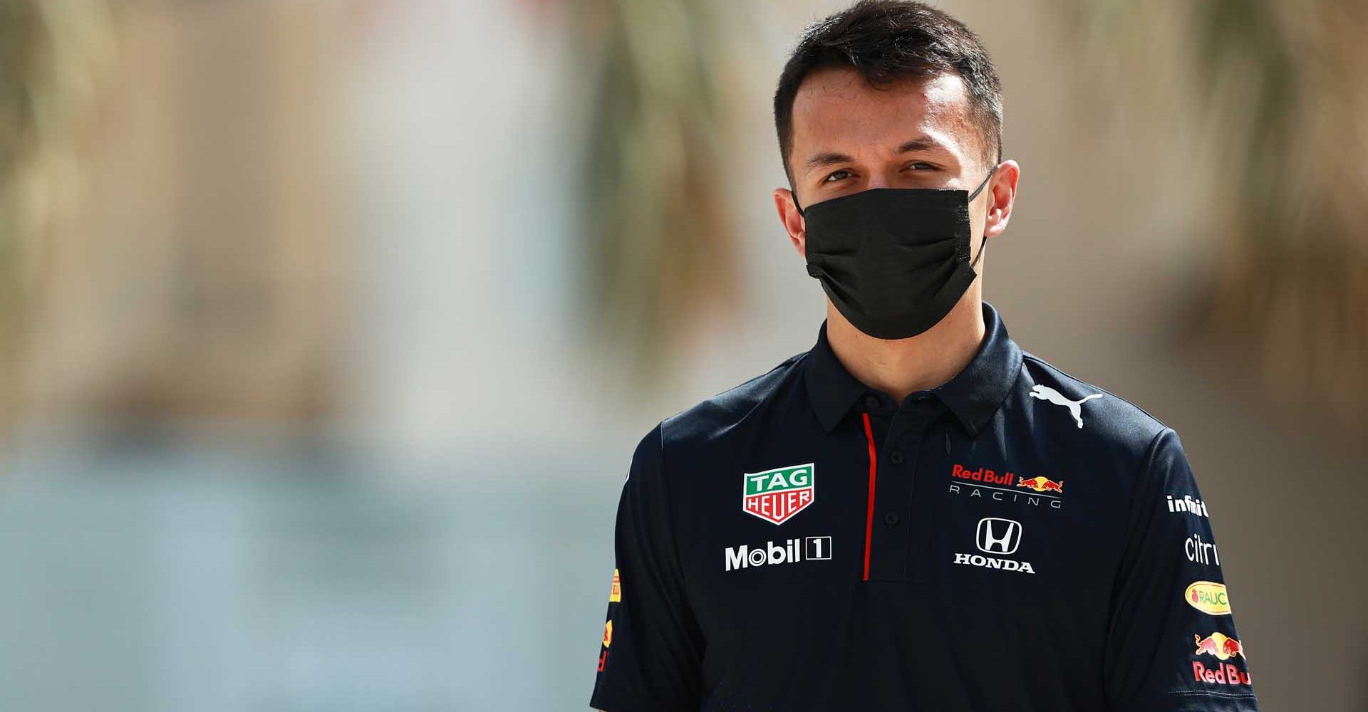 BAHRAIN, BAHRAIN - MARCH 25: Alexander Albon of Thailand and Red Bull Racing walks in the Paddock during previews ahead of the F1 Grand Prix of Bahrain at Bahrain International Circuit on March 25, 2021 in Bahrain, Bahrain. (Photo by Mark Thompson/Getty Images)